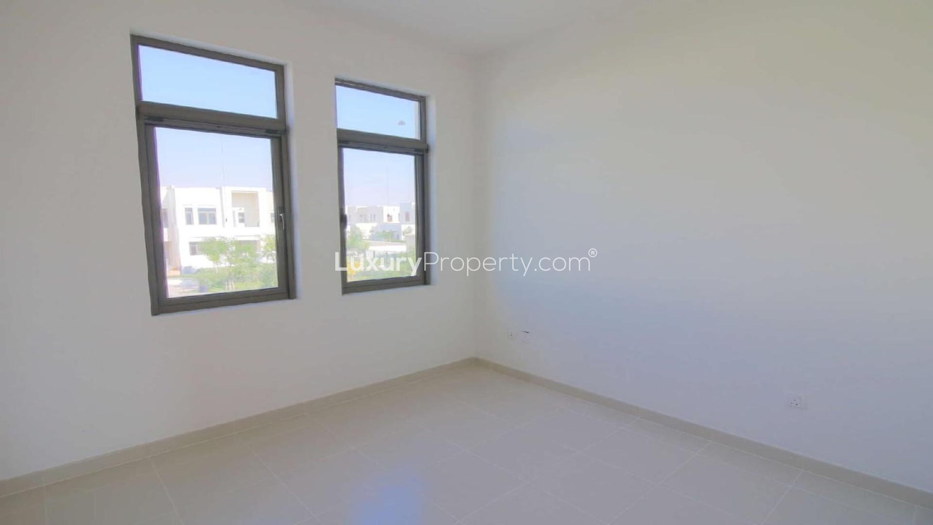 Townhouse view in Mira Oasis 3, Reem with lush greenery and modern architecture