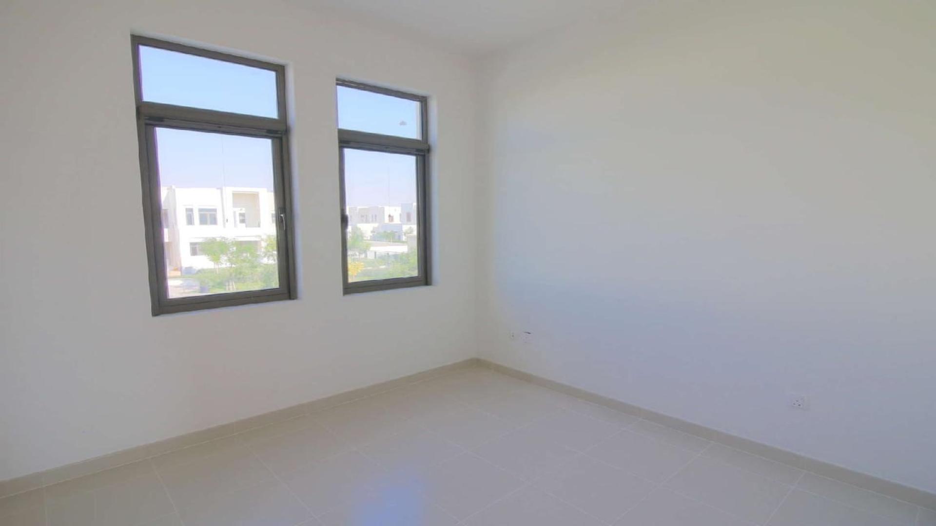 Townhouse view in Mira Oasis 3, Reem with lush greenery and modern architecture