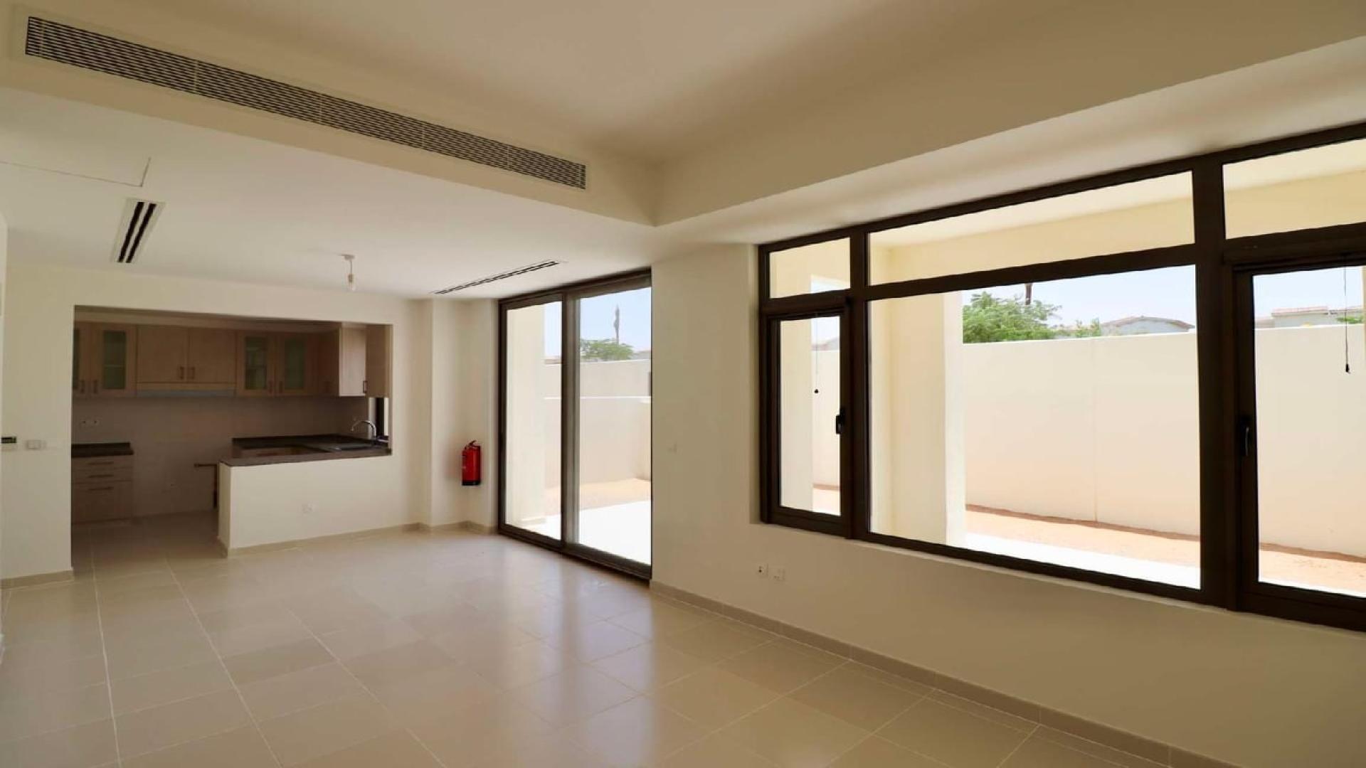 Bright living area with large windows in Mira Oasis 3 townhouse, Dubai