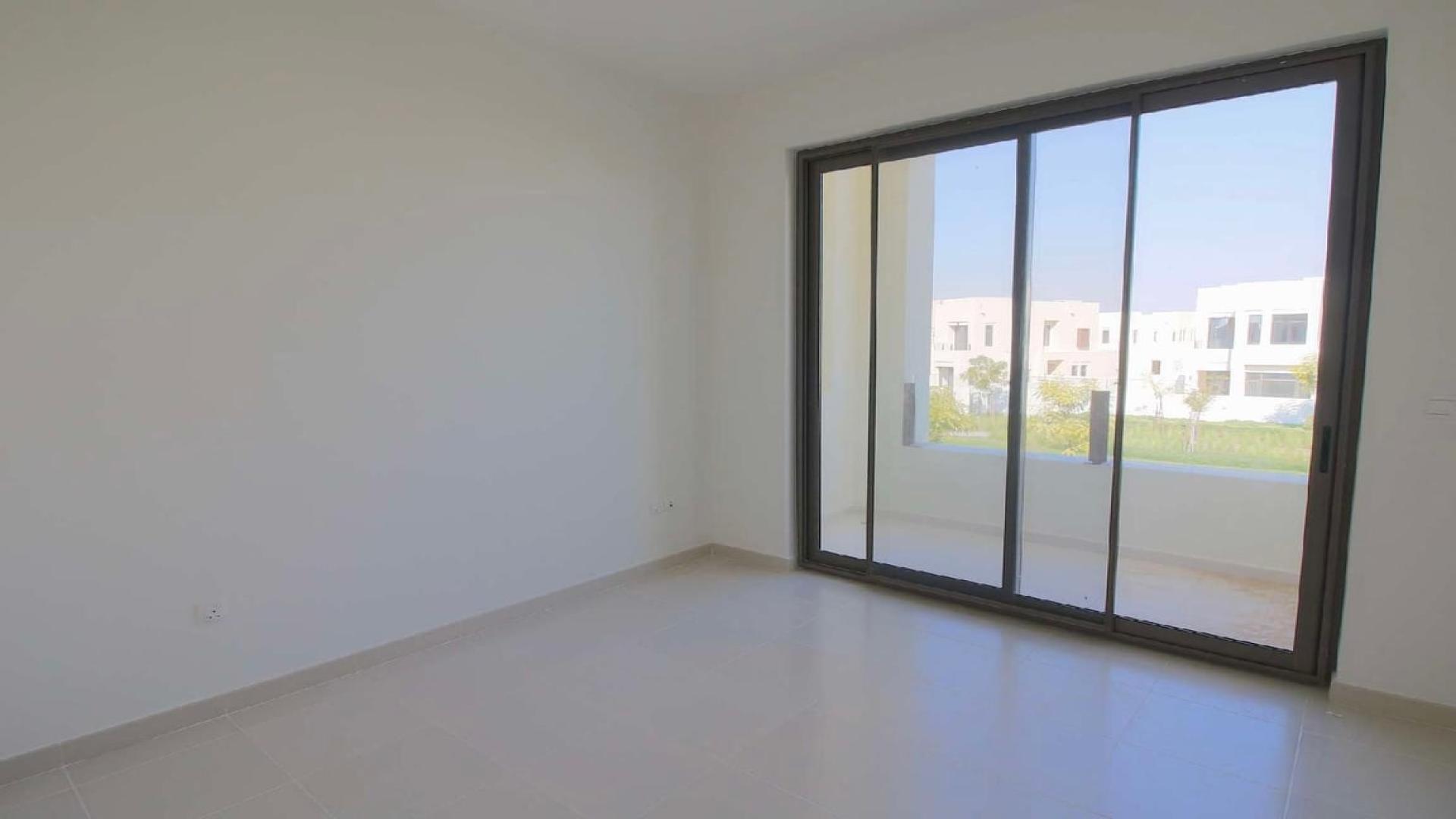 Spacious living room in 4-bedroom townhouse, Mira Oasis 3, Dubai, with large windows
