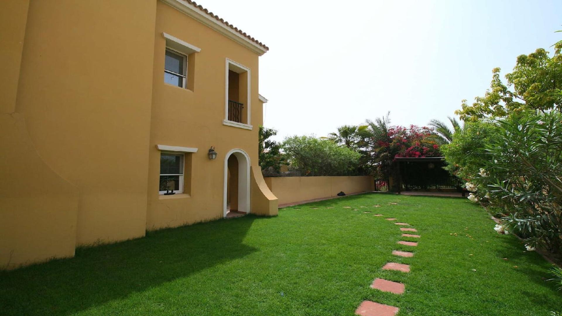Immaculate townhouse garden with lush greenery in Palmera 2, Arabian Ranches for rent