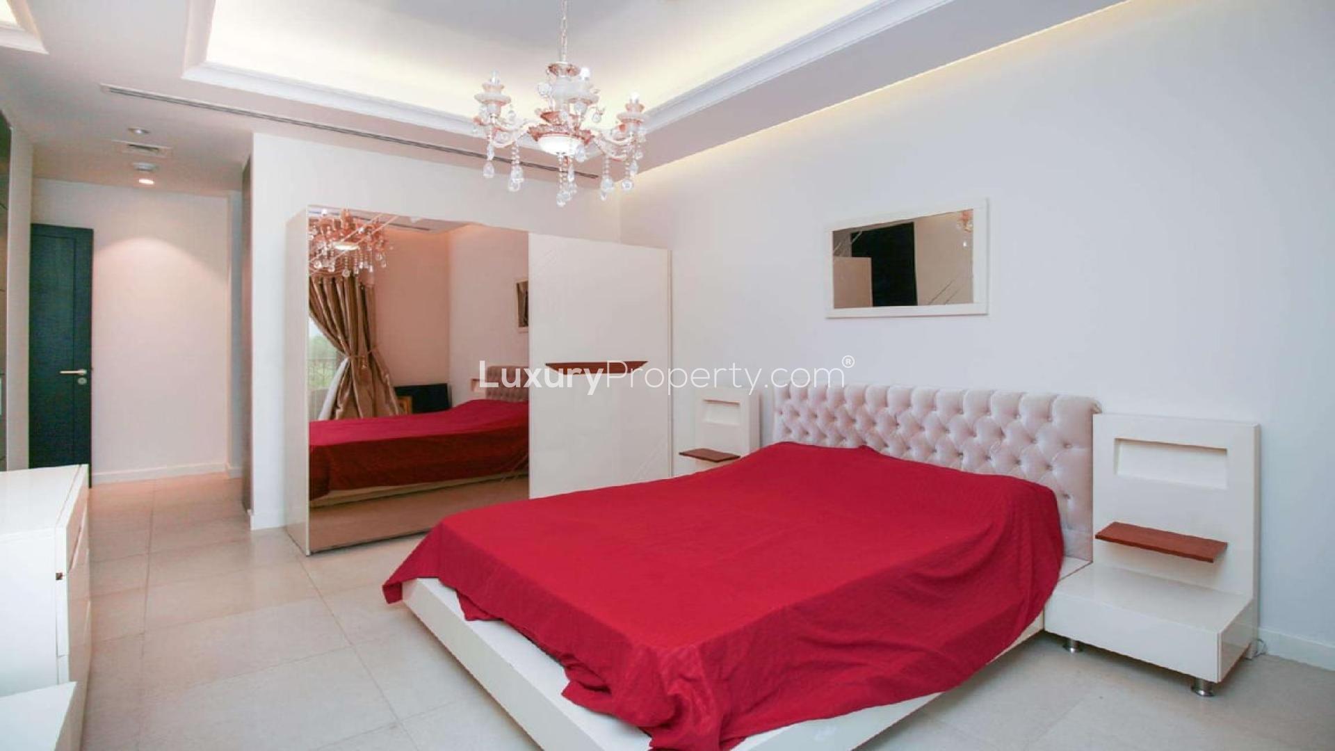 Elegant 6-bed townhouse exterior with balcony in Jumeirah Golf Estates, Redwood Park