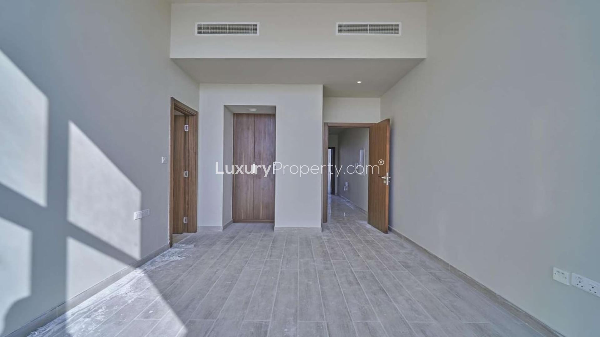 Modern kitchen and bright living area in Al Furjan townhouse, Murano Residences