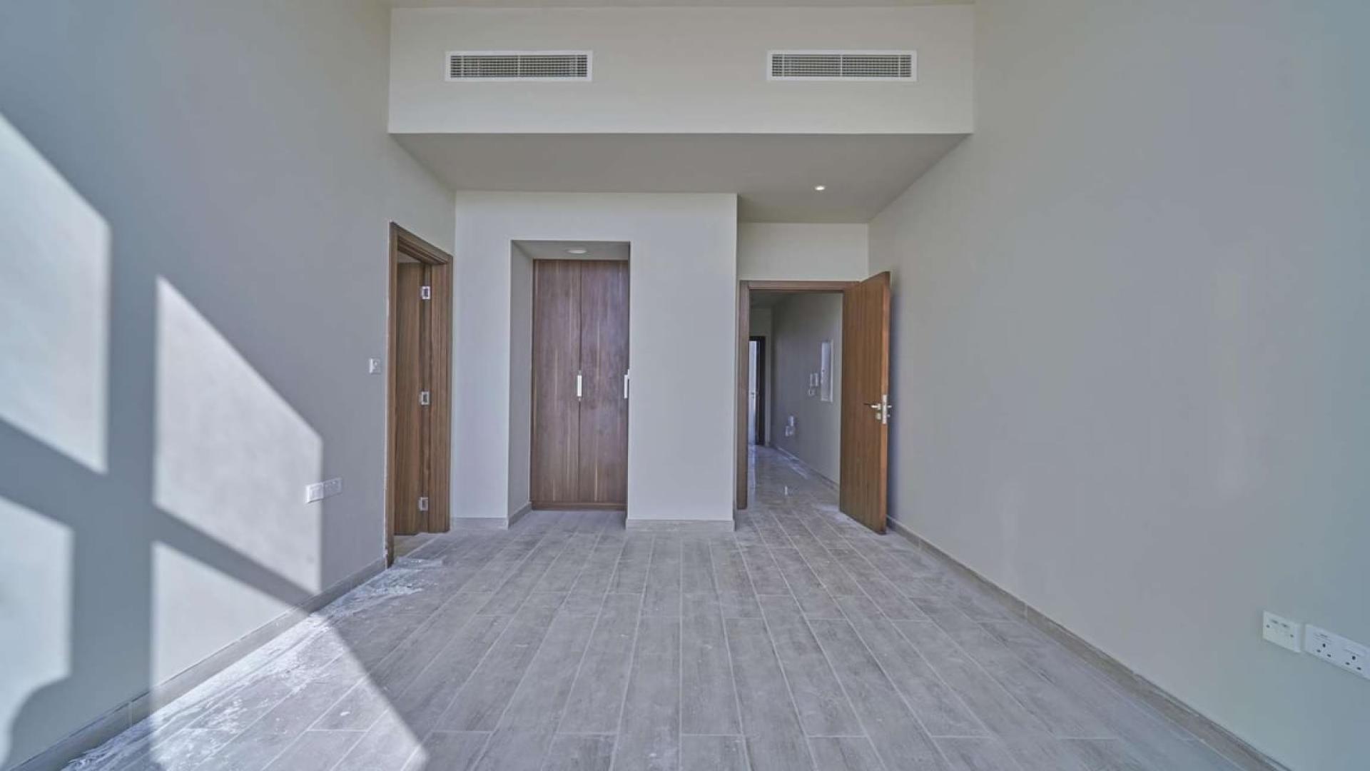 Modern kitchen and bright living area in Al Furjan townhouse, Murano Residences