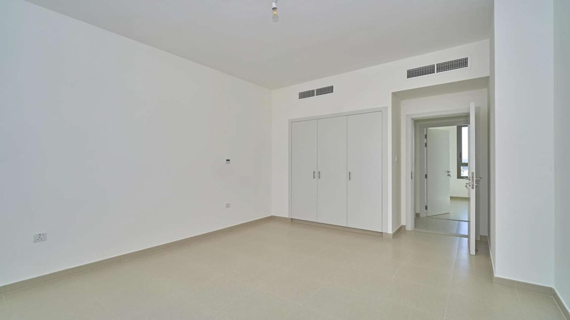 Spacious 4-bedroom townhouse exterior in Naseem Townhouses, Town Square, available for rent