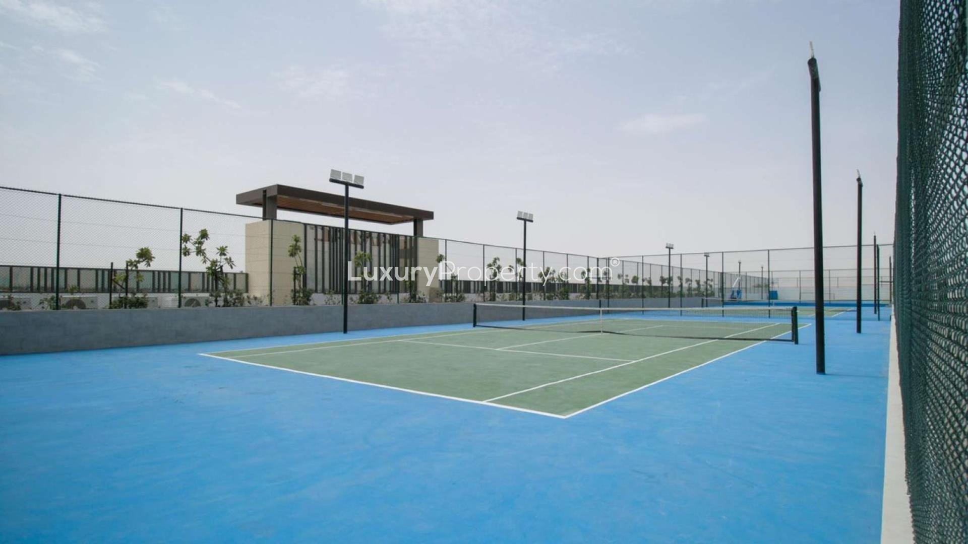 Outdoor tennis court at Damac Hills 2 townhouse, perfect for family recreation and fitness