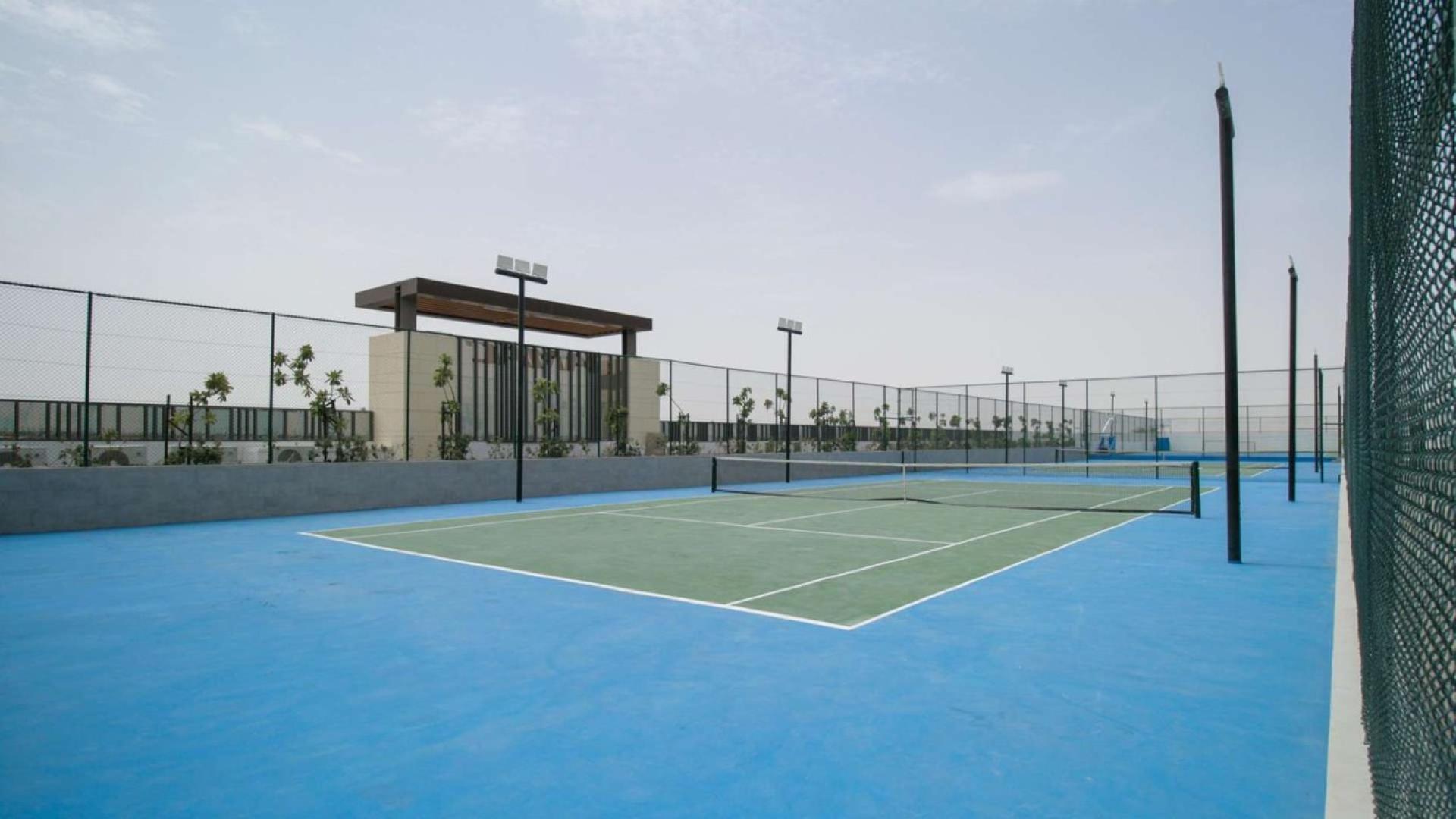 Outdoor tennis court at Damac Hills 2 townhouse, perfect for family recreation and fitness