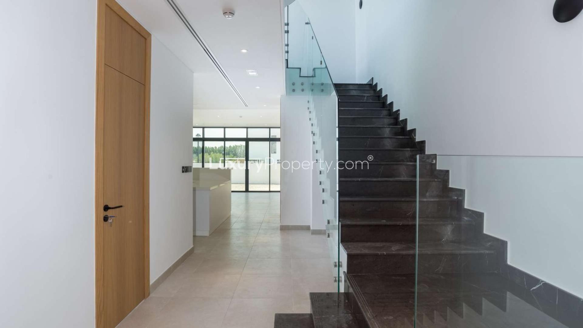 Modern four-bedroom townhouse exterior in Jumeirah Golf Estates, Jumeirah Luxury community