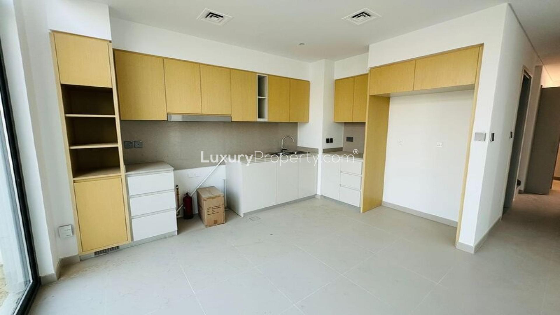 Modern kitchen and living area in 4-bedroom townhouse, Arabian Ranches 3, Spring community