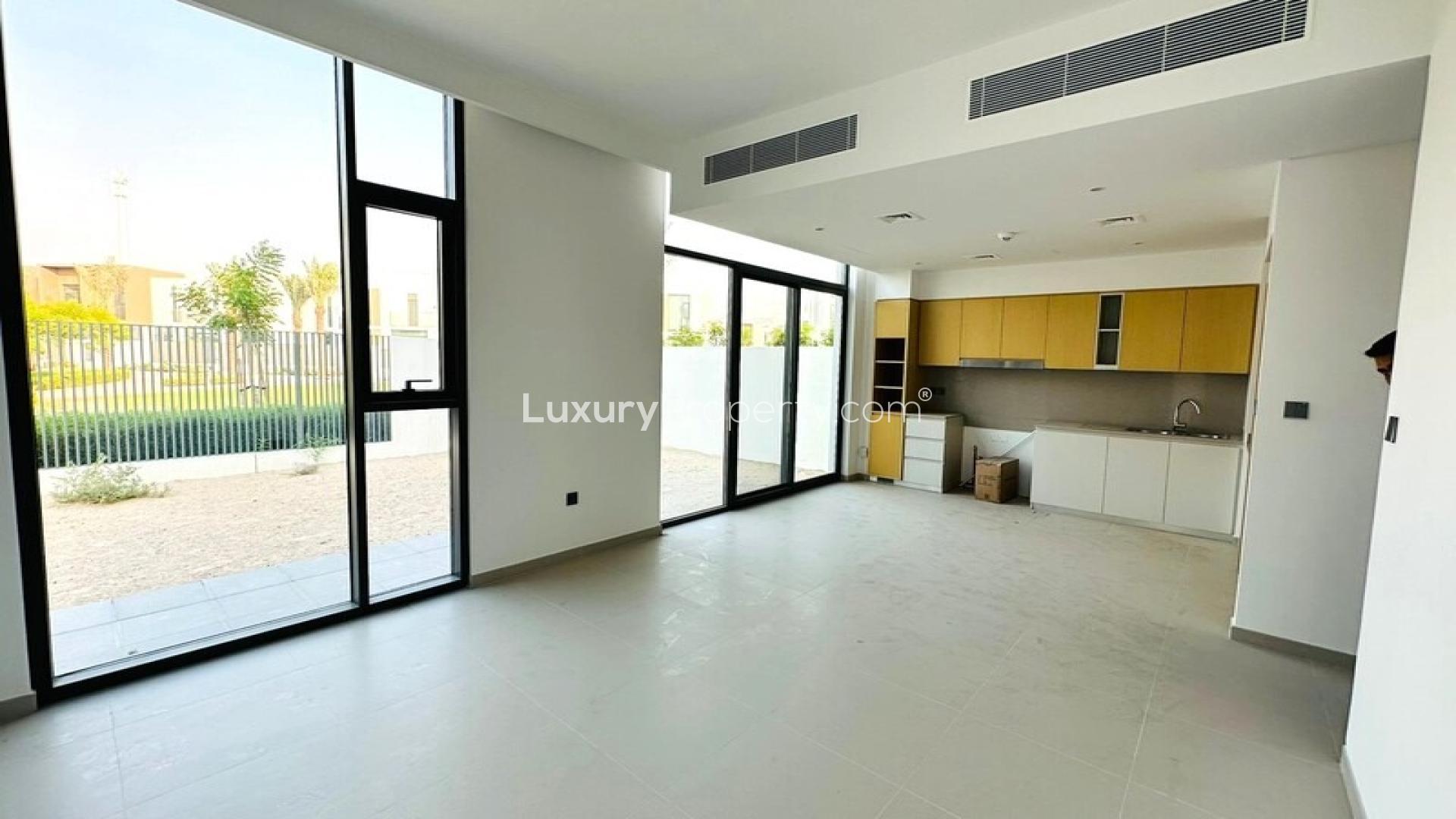 Elegant townhouse exterior with spacious driveway in Spring, Arabian Ranches 3