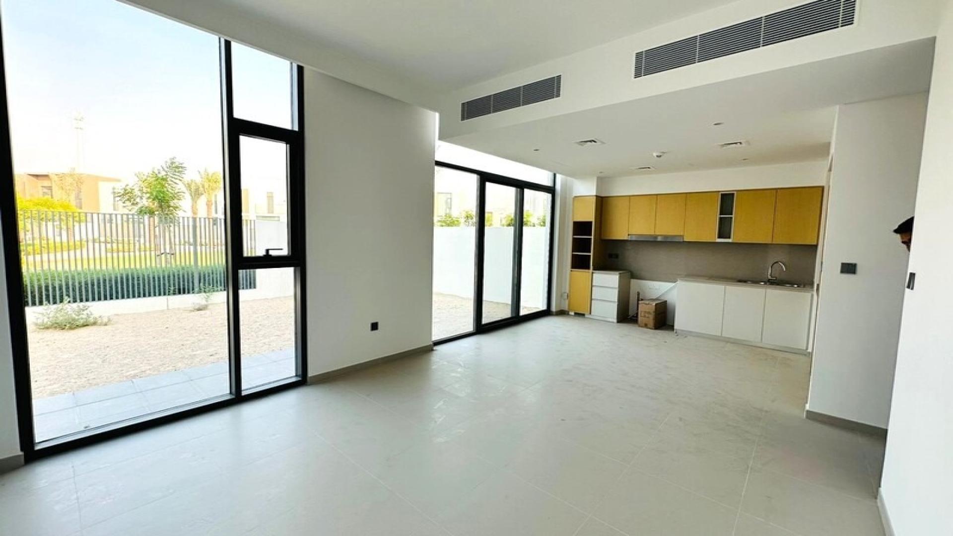 Elegant townhouse exterior with spacious driveway in Spring, Arabian Ranches 3