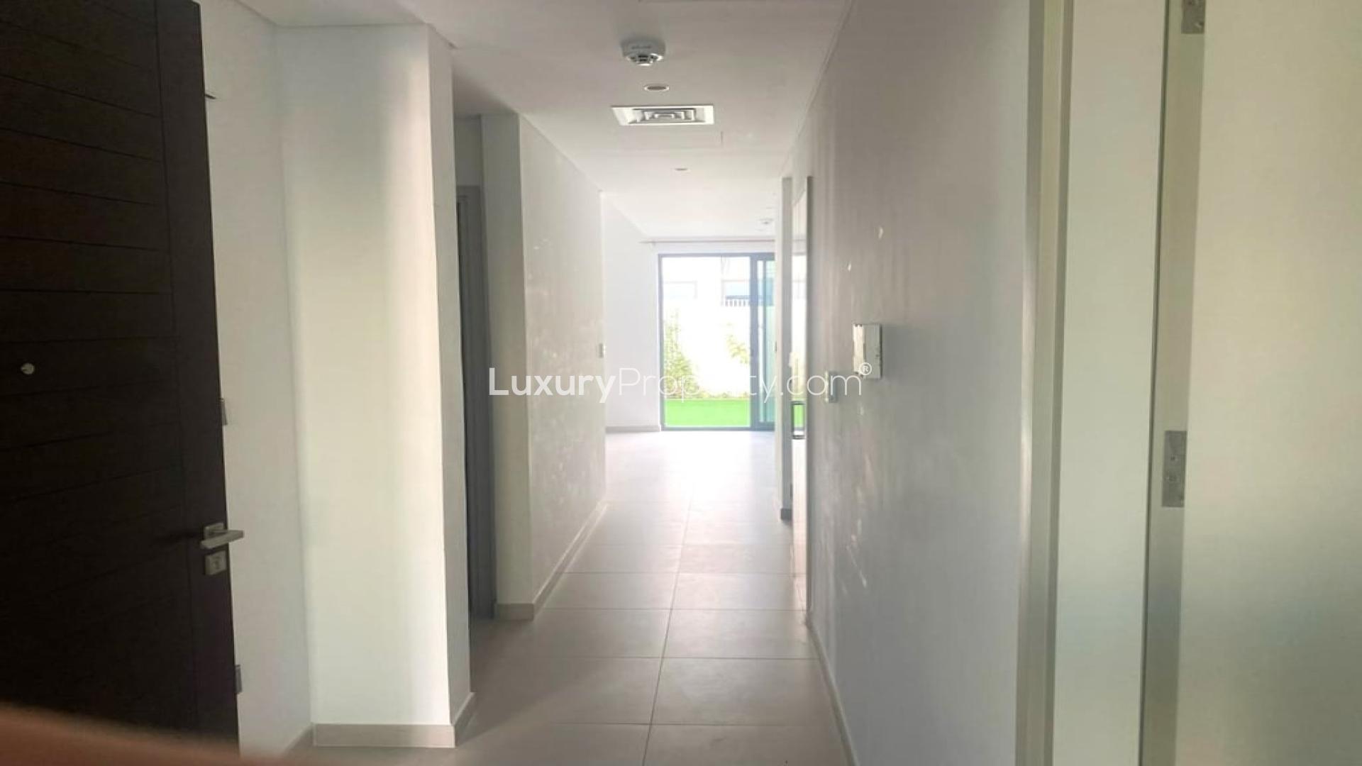 Spacious living area in vacant 4-bedroom townhouse, Arabian Ranches 3, Joy community, for rent