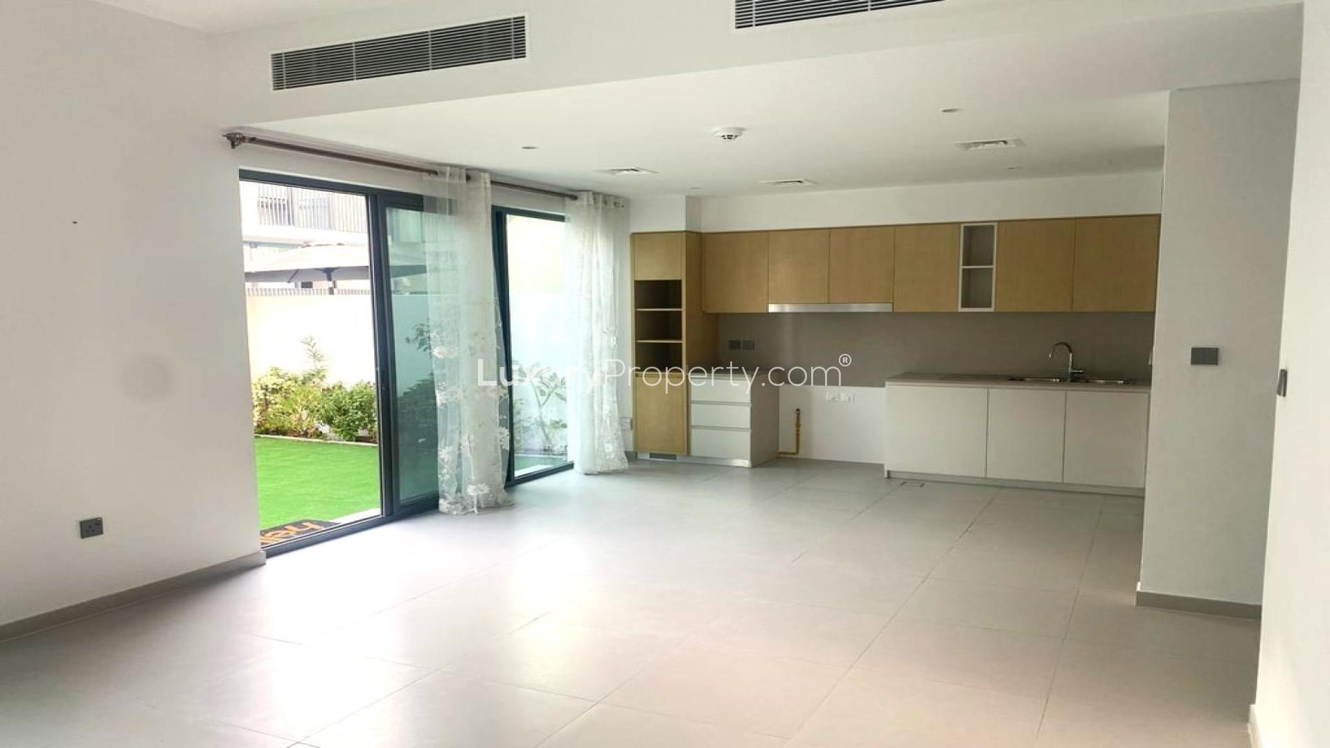 Modern 4-bedroom townhouse in Arabian Ranches 3, Joy, with spacious carport and greenery