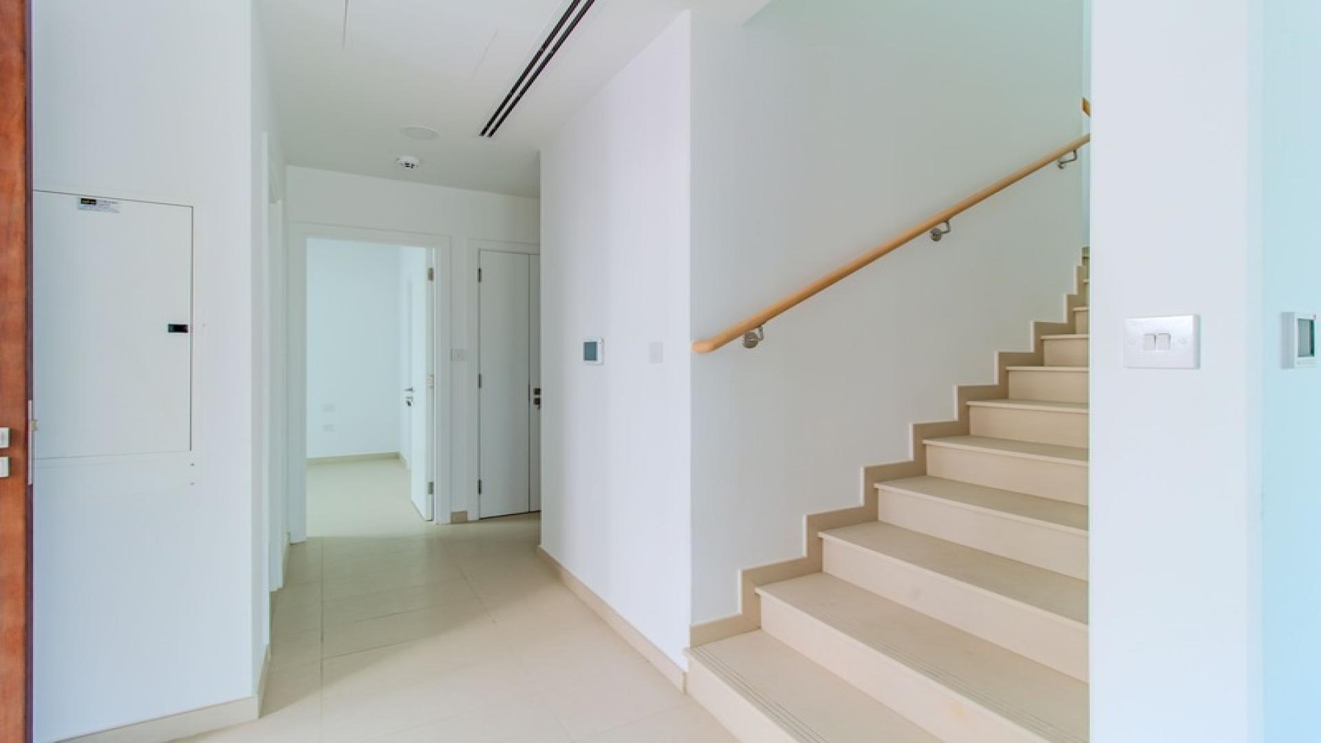 Modern 4-bedroom townhouse exterior in Cherrywoods, Dubailand, available for rent