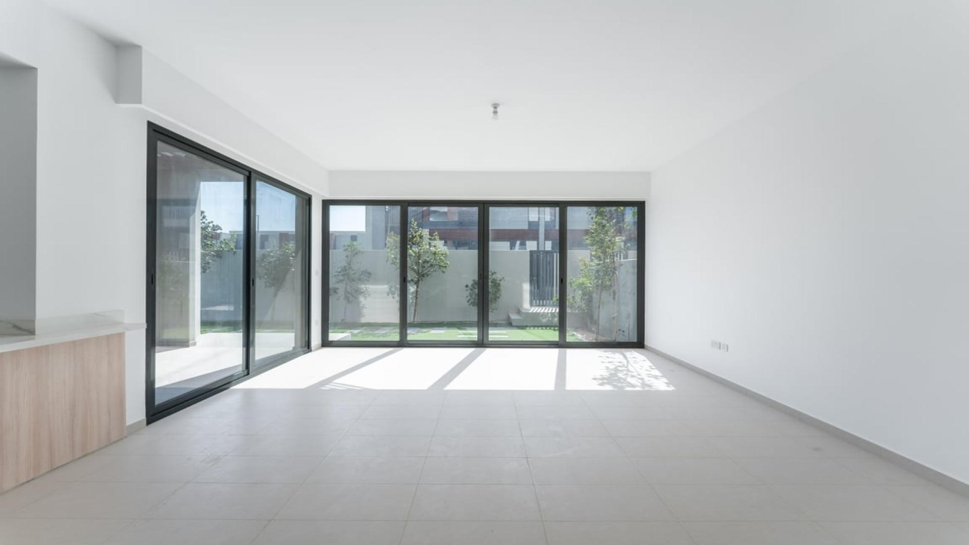 Bright open-plan kitchen and living area in Cherrywoods townhouse, Dubai Land. Rent now