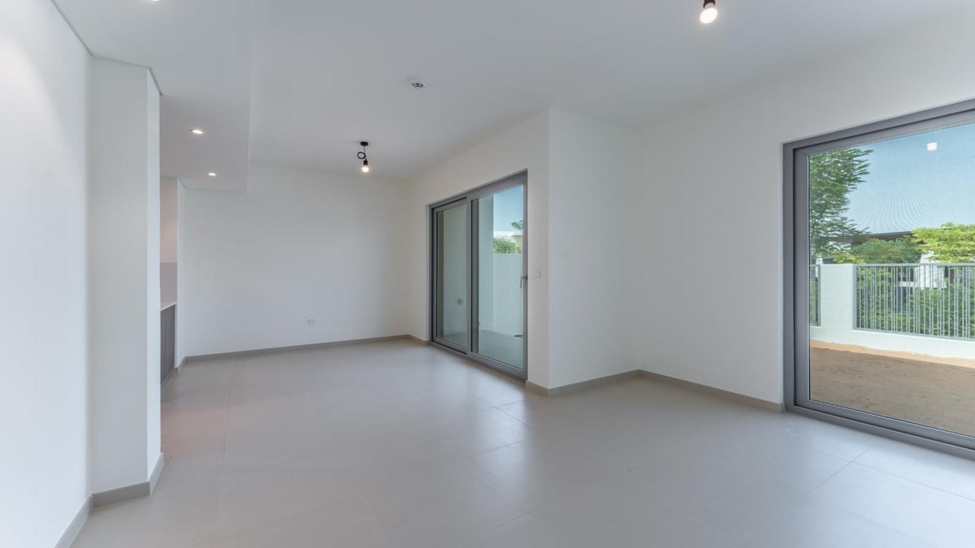 Spacious living area with large windows in Elan townhouse, Tilal Al Ghaf community