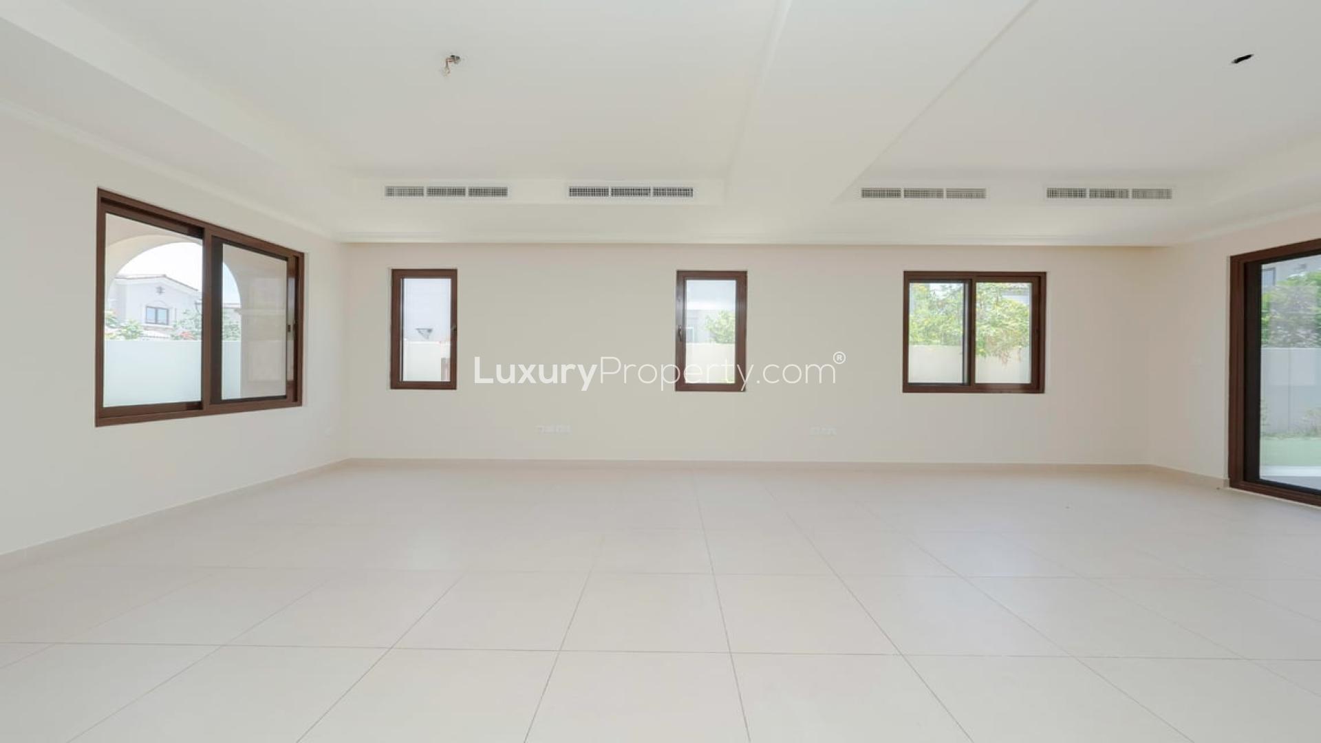 Spacious living room in Arabian Ranches 2 townhouse for rent, large windows, tiled floor