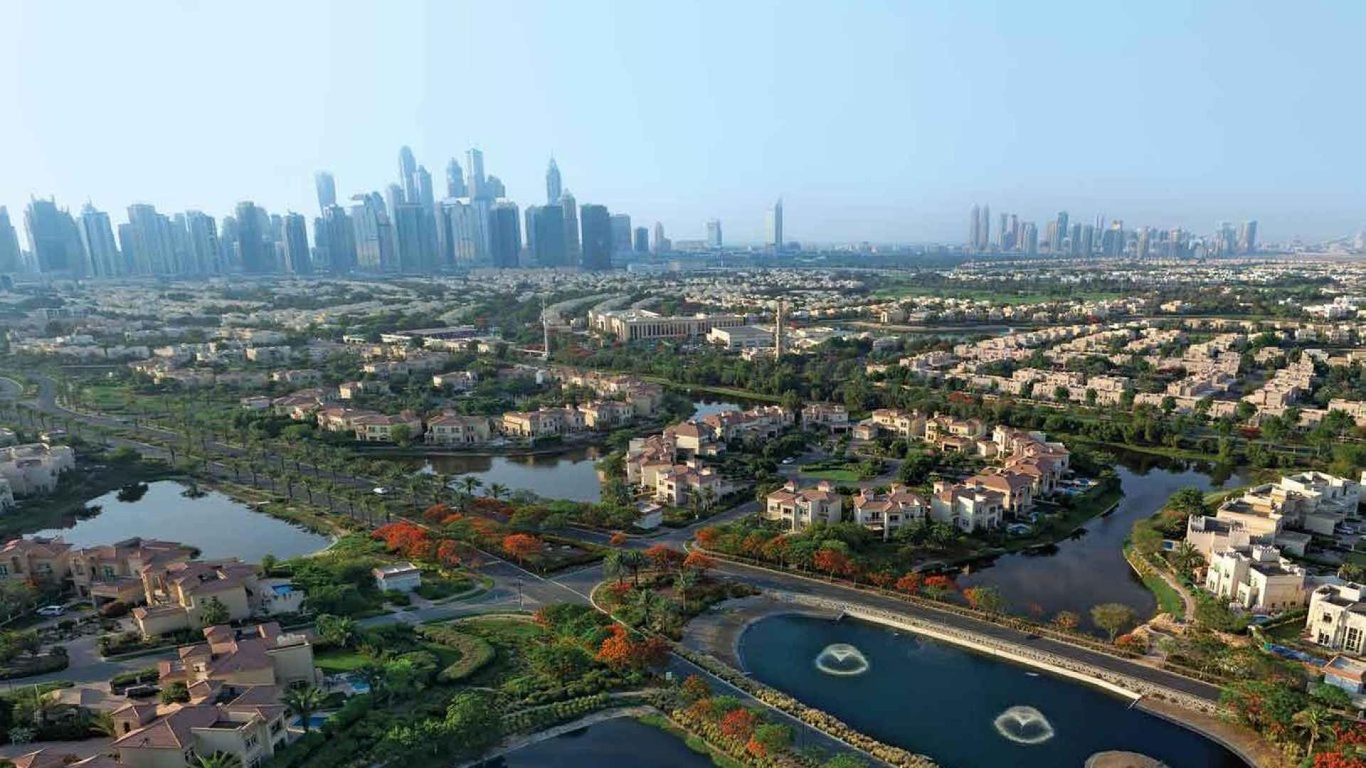 Modern living room in four-bed townhouse, Jumeirah Islands, with stylish decor and natural light