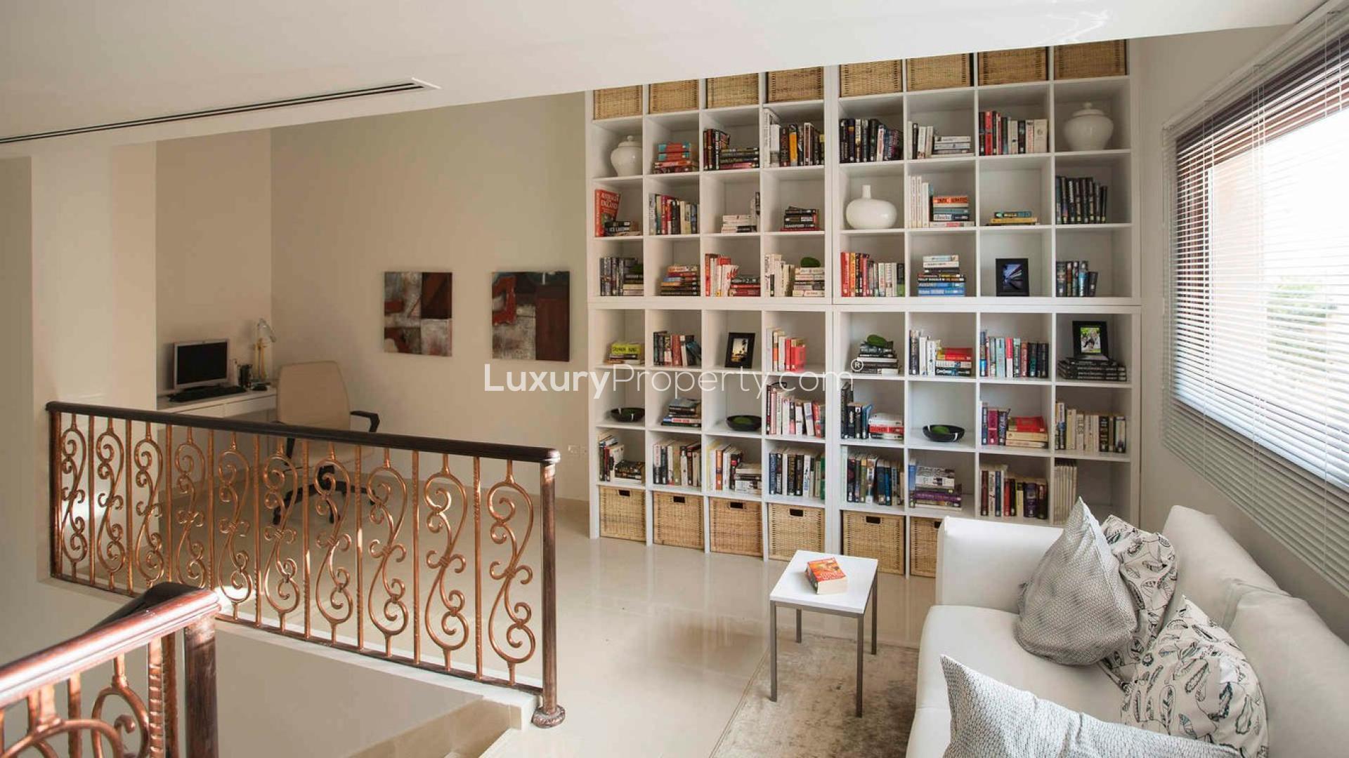 Cozy reading nook with bookshelves in Jumeirah Islands townhouse for sale, Ref LP01426