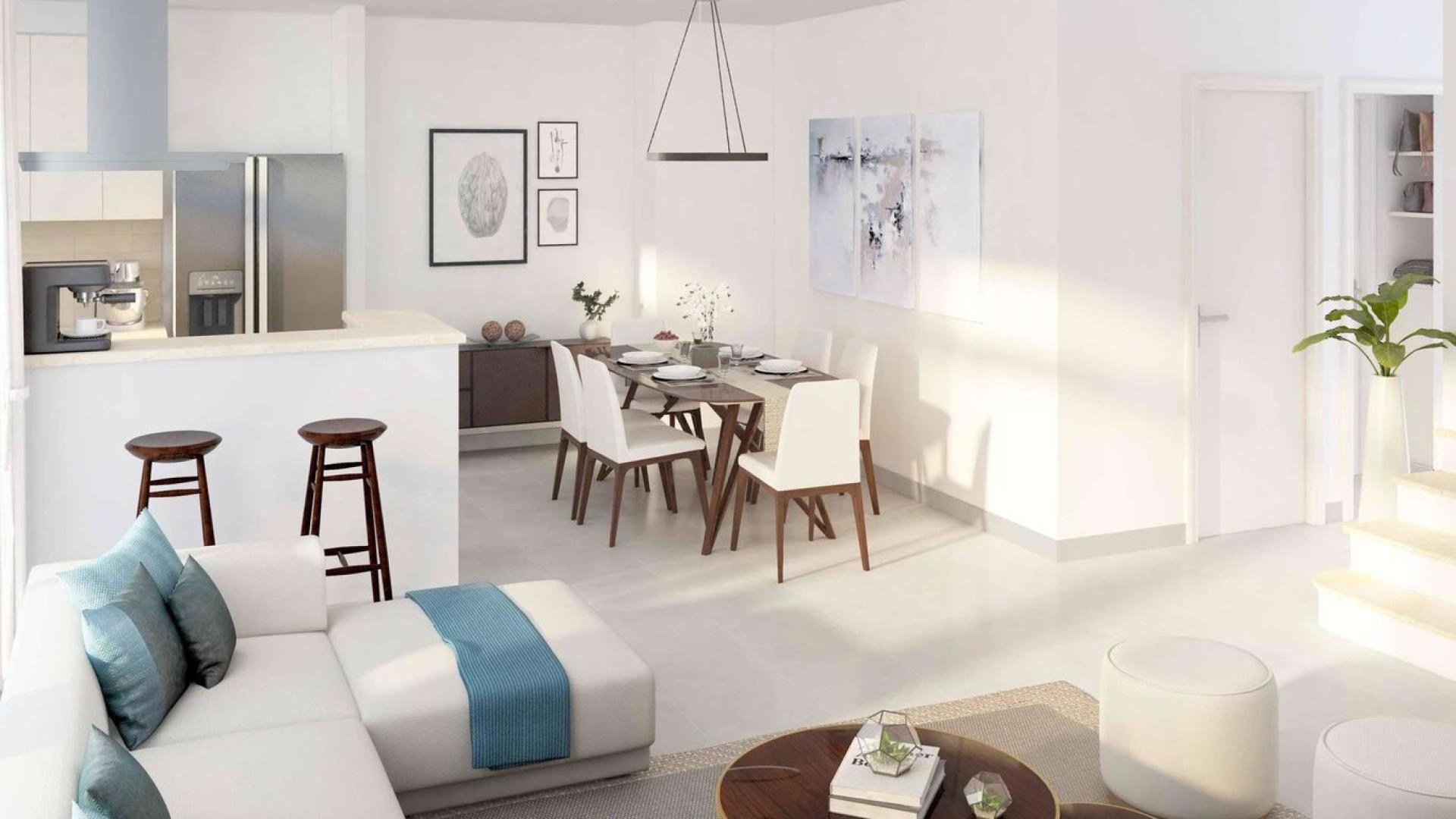 Modern open-plan living and dining area in Naseem Townhouse, Town Square Dubai