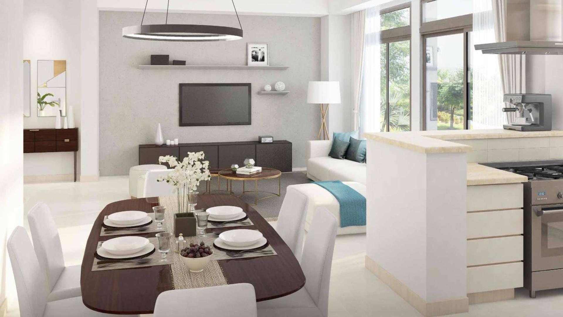 Spacious townhouse exterior in Naseem, Town Square Dubai, featuring landscaped street and modern design