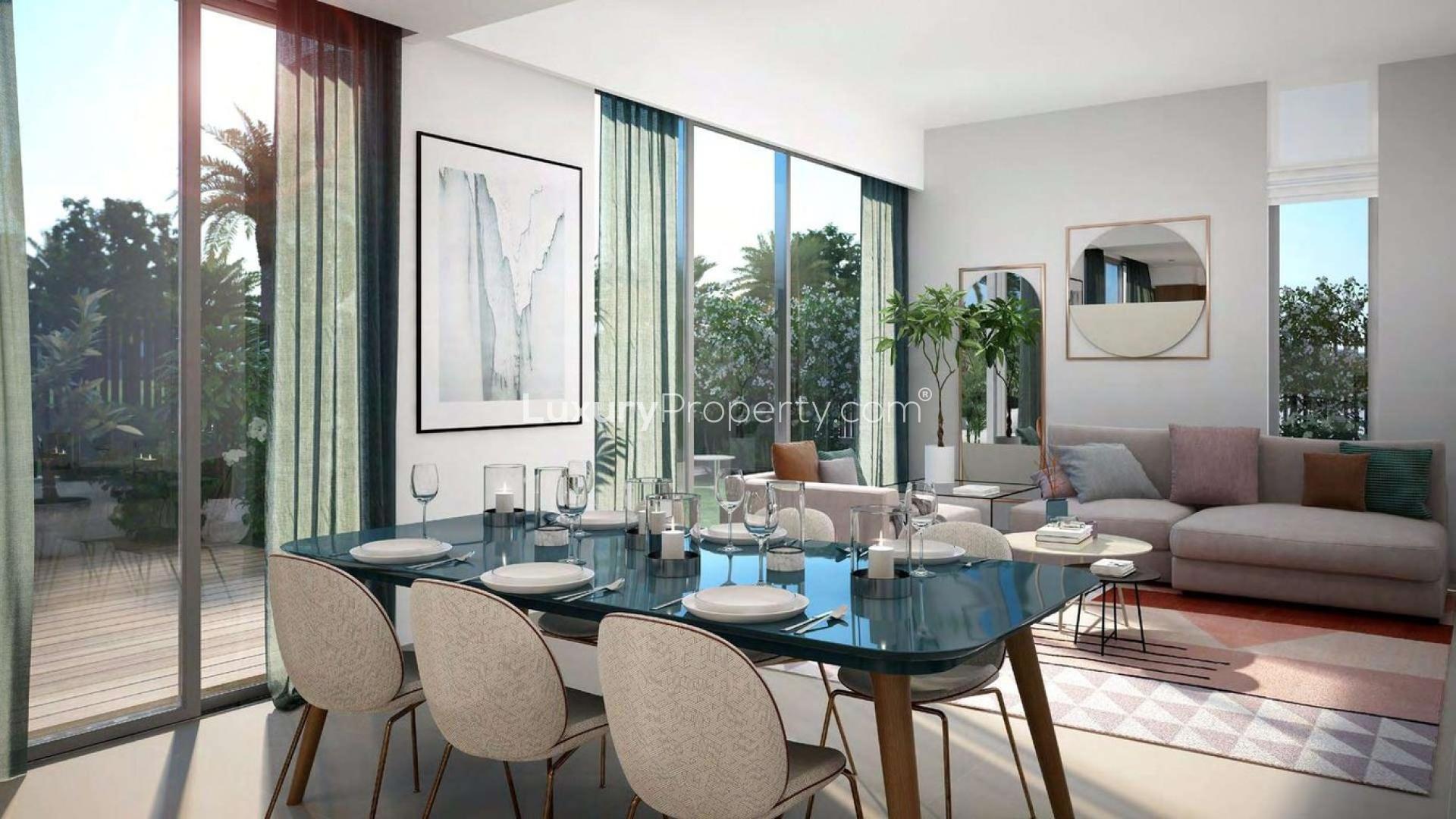 Modern living room in Spring Townhouses, Arabian Ranches III, with elegant dining setup