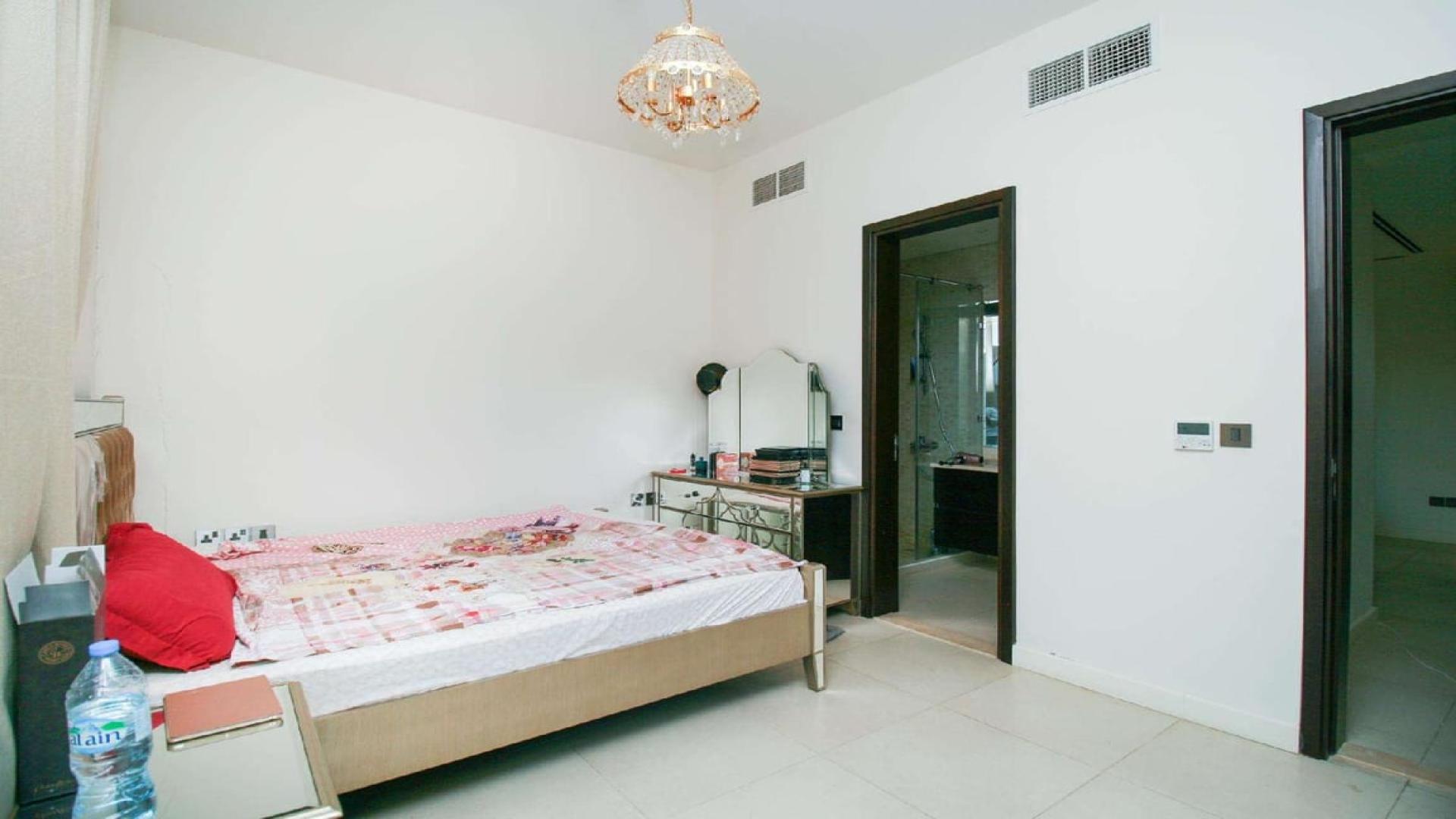 Four-bedroom townhouse on corner plot, Jumeirah Golf Estates, Fire, with garage and palm tree