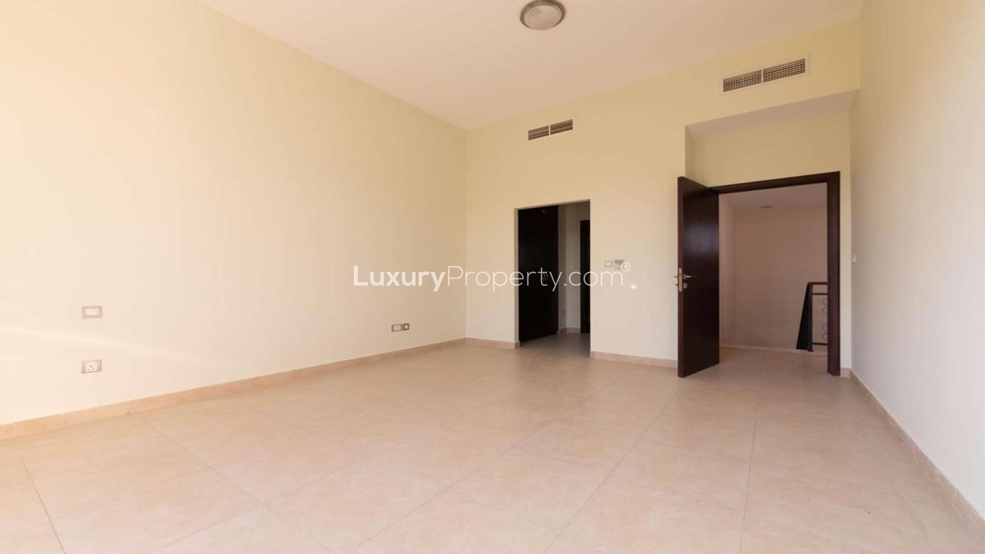 Bright bedroom in Naseem townhouse, Mudon with large windows and built-in wardrobe