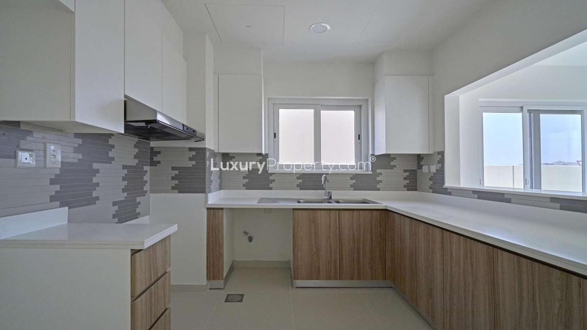 Modern kitchen in brand-new 4-bedroom townhouse, Villanova, Dubai Land, for sale