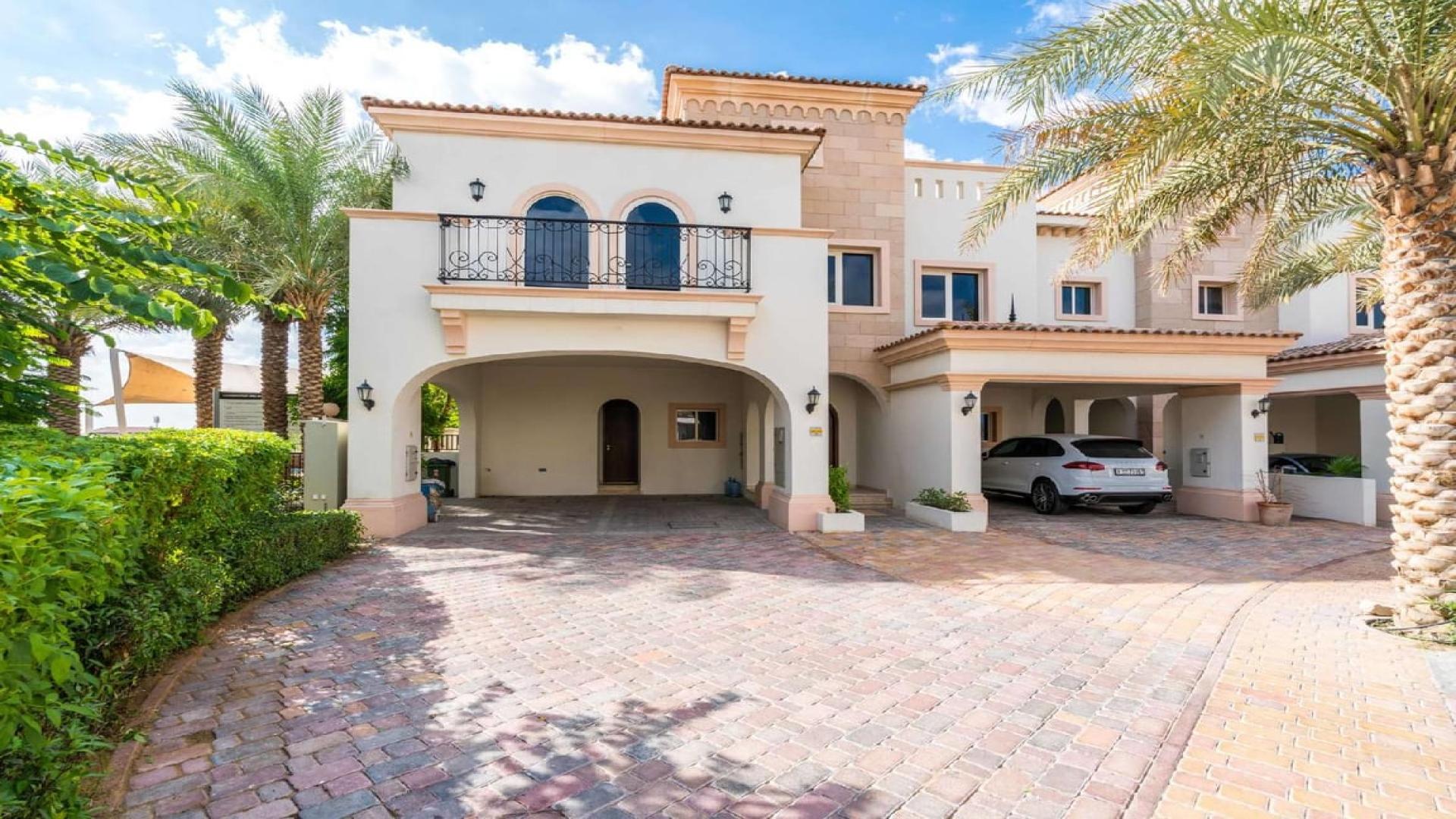 "Spacious living area with large windows in Mediterranean townhouse, Jumeirah Golf Estates, Fire community.",Stylish Mediterranean townhouse exterior in Jumeirah Golf Estates, Fire community, for sale