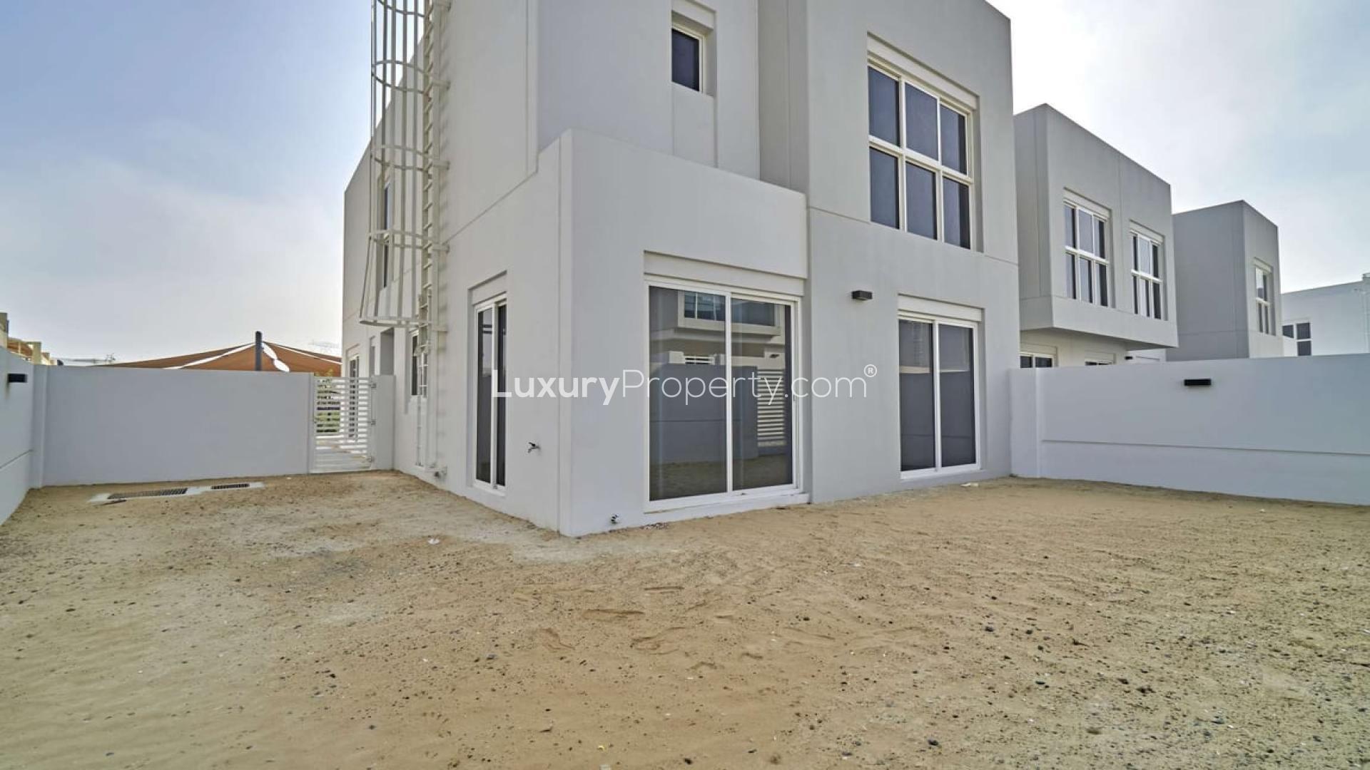 Modern interior of a four-bedroom townhouse in Arabella, Mudon with glass staircase