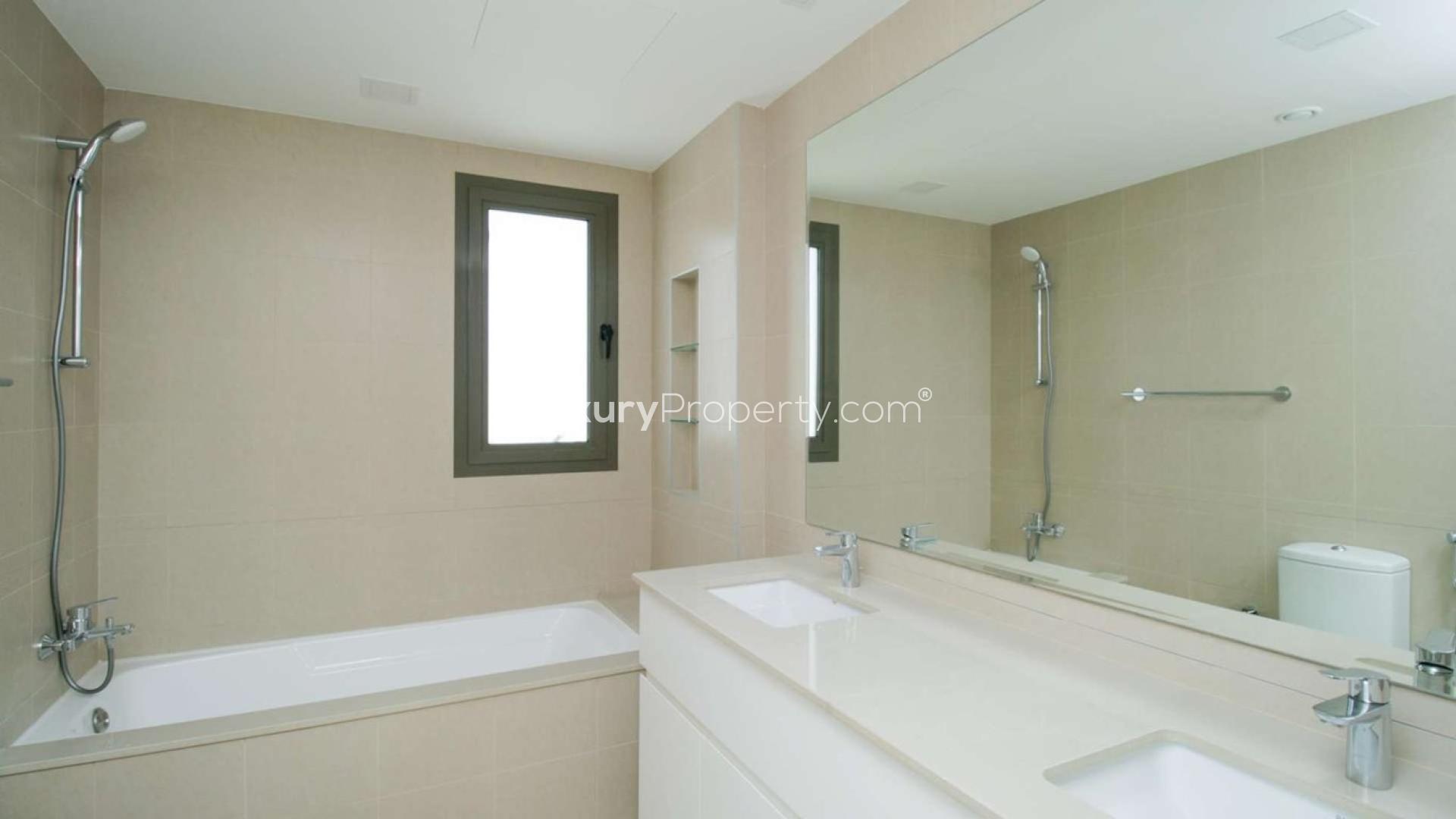 Bright open-plan kitchen and living area in Noor Community townhouse for sale