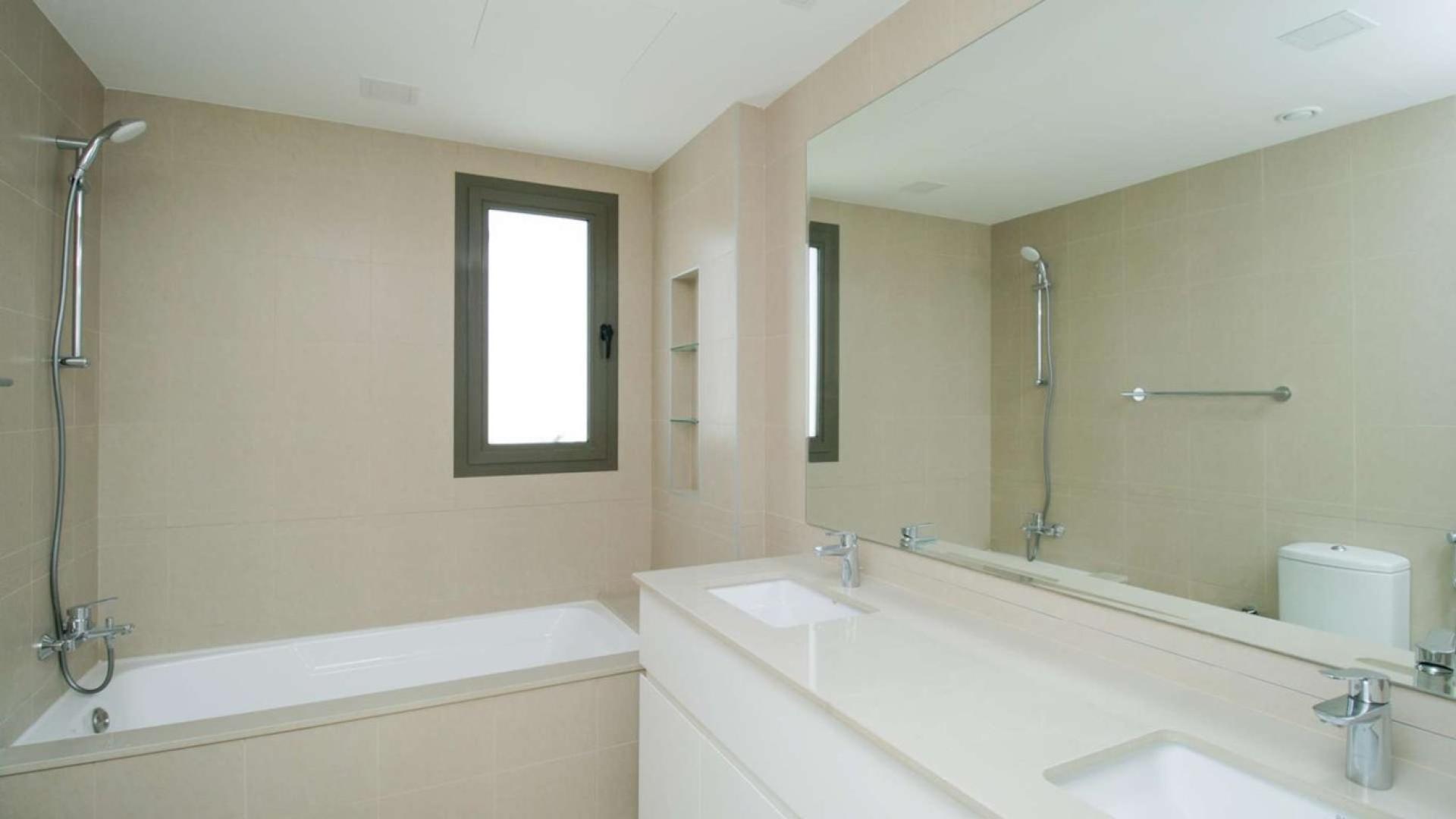 Bright open-plan kitchen and living area in Noor Community townhouse for sale