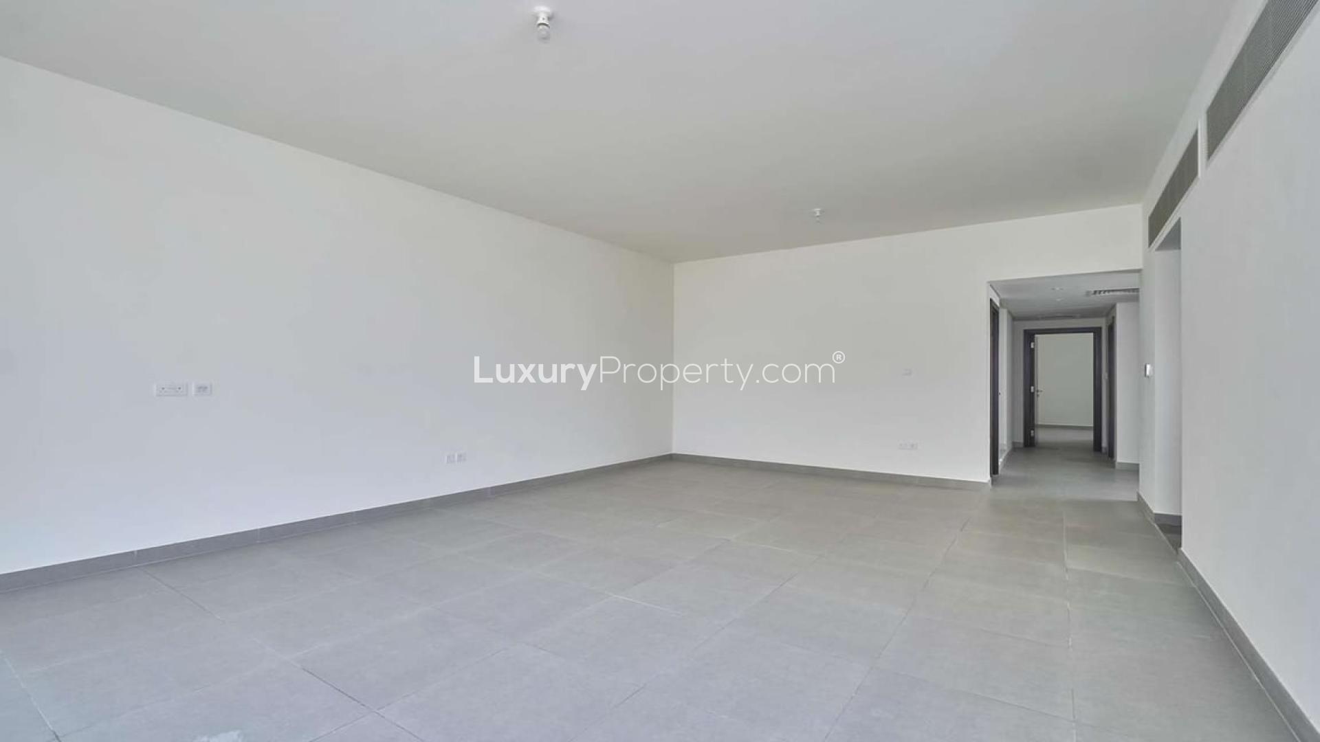 "Spacious living area in vacant Arabella townhouse, Mudon, with modern tile flooring.",Vacant corner plot townhouse interior in Arabella, Mudon, featuring large windows and tiled flooring