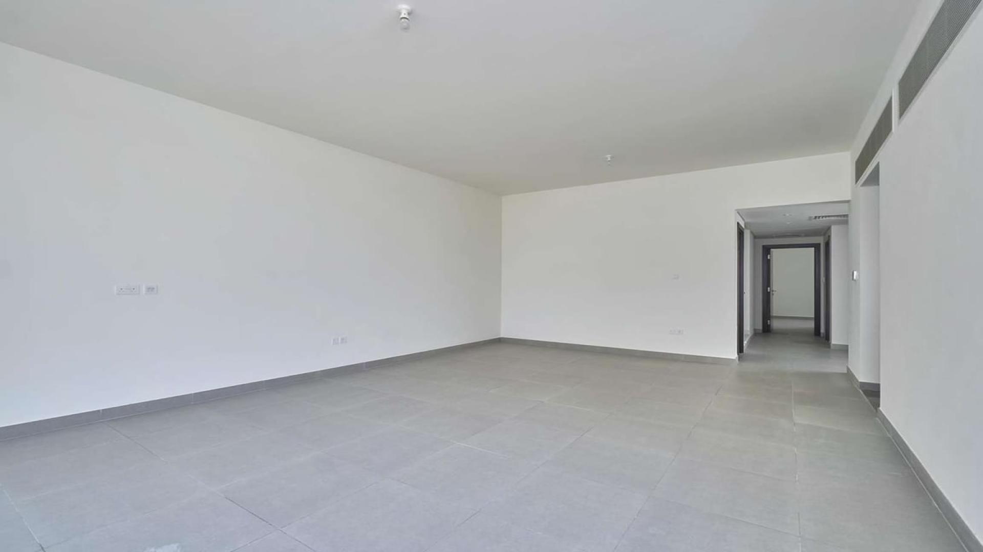 "Spacious living area in vacant Arabella townhouse, Mudon, with modern tile flooring.",Vacant corner plot townhouse interior in Arabella, Mudon, featuring large windows and tiled flooring