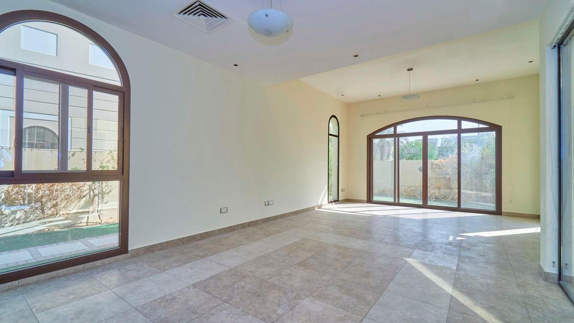Corner townhouse with garden in Naseem, Mudon community, featuring elegant architecture