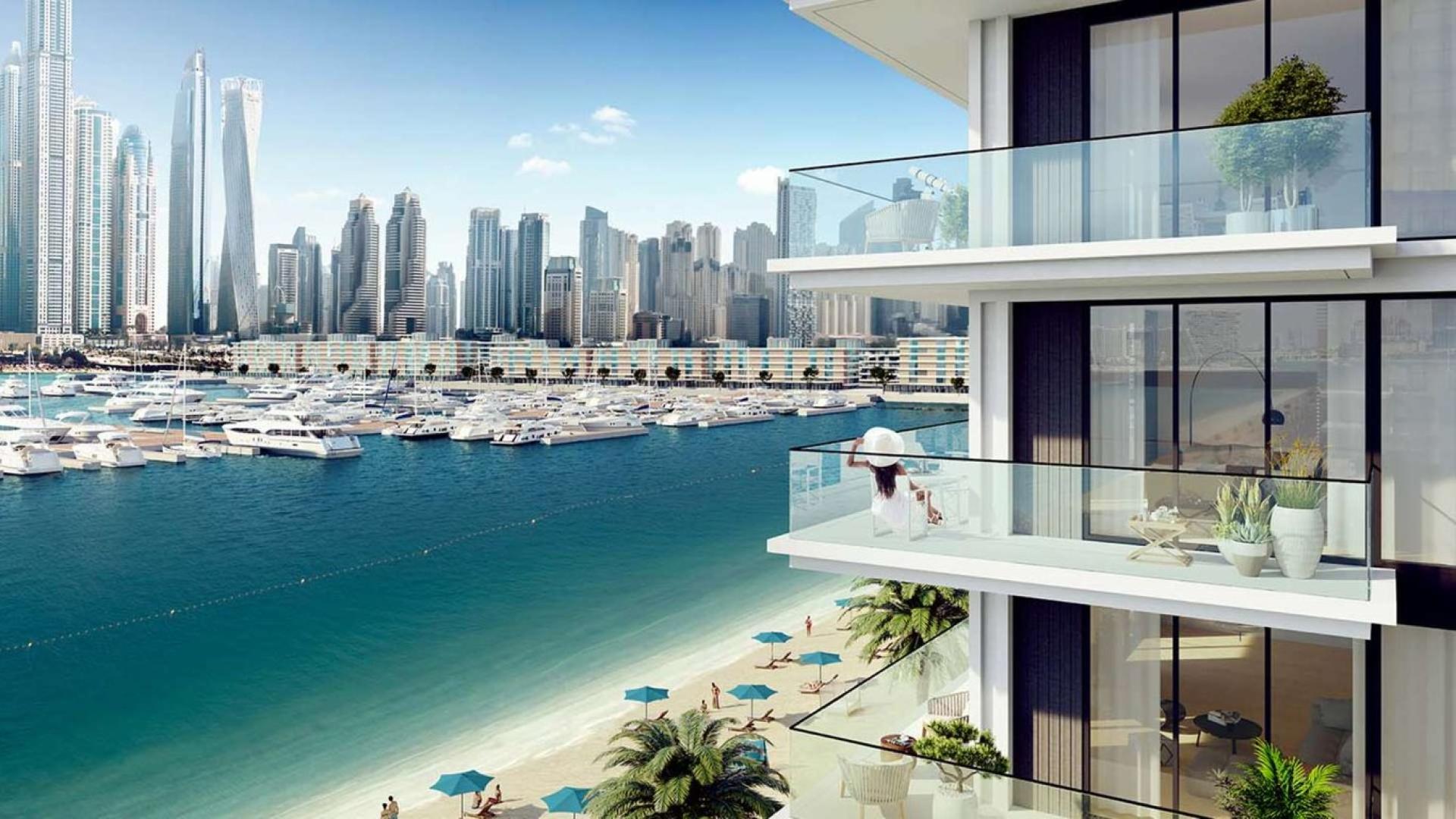 Modern living room in Emaar Beachfront townhouse with city skyline views, Dubai Harbour