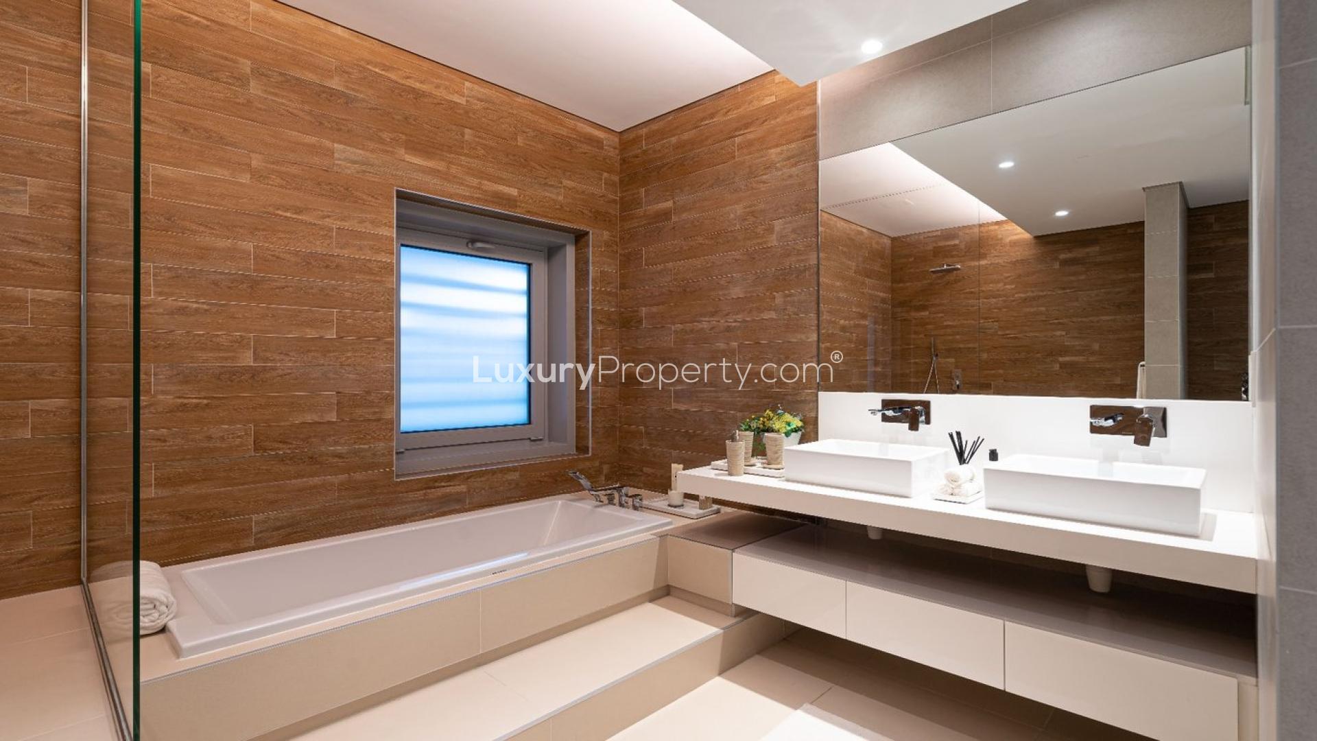 Modern 4-bedroom townhouse exterior in Bluewaters Residences, lush landscaping, for sale