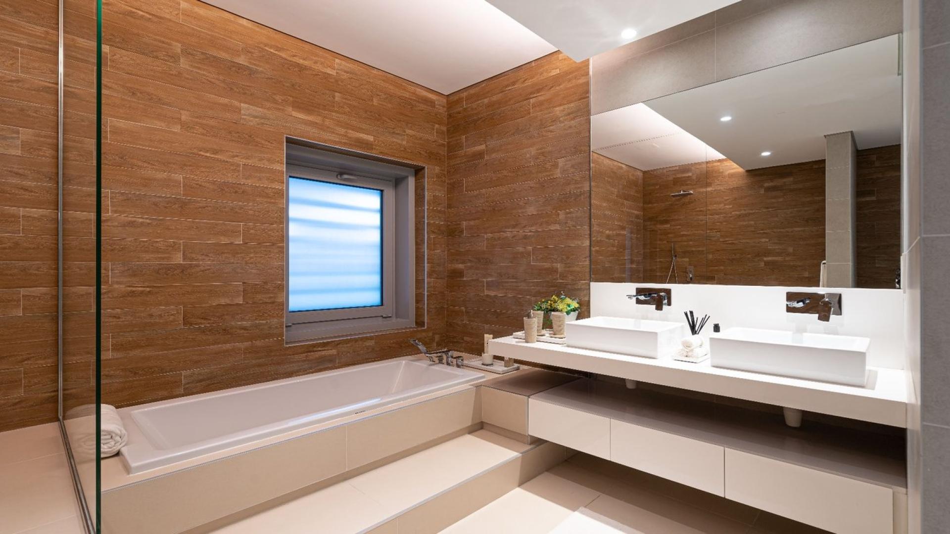 Modern 4-bedroom townhouse exterior in Bluewaters Residences, lush landscaping, for sale