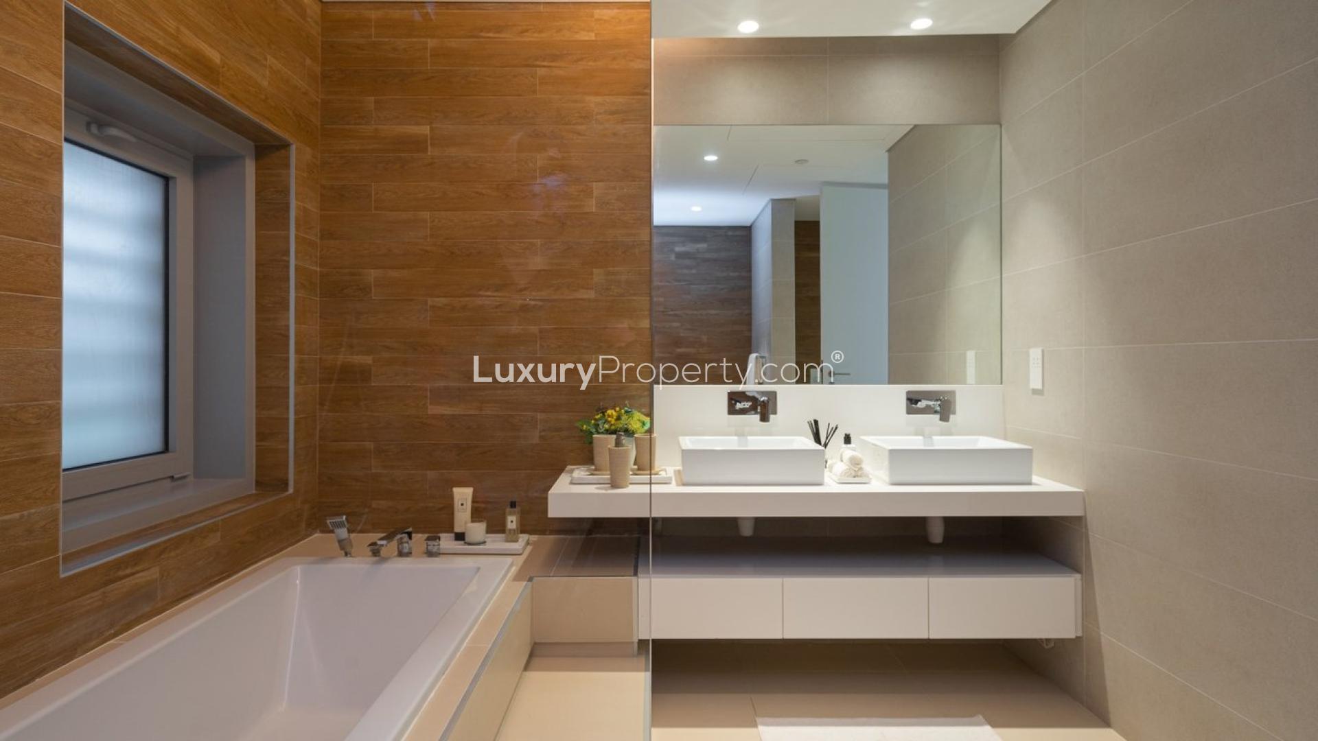 Modern kitchen and living area in Bluewaters townhouse, featuring sleek design and ocean views