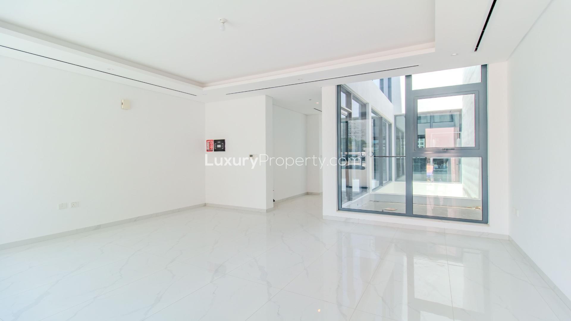 Brand new Jumeirah Village Circle townhouse with modern interior and large windows for sale