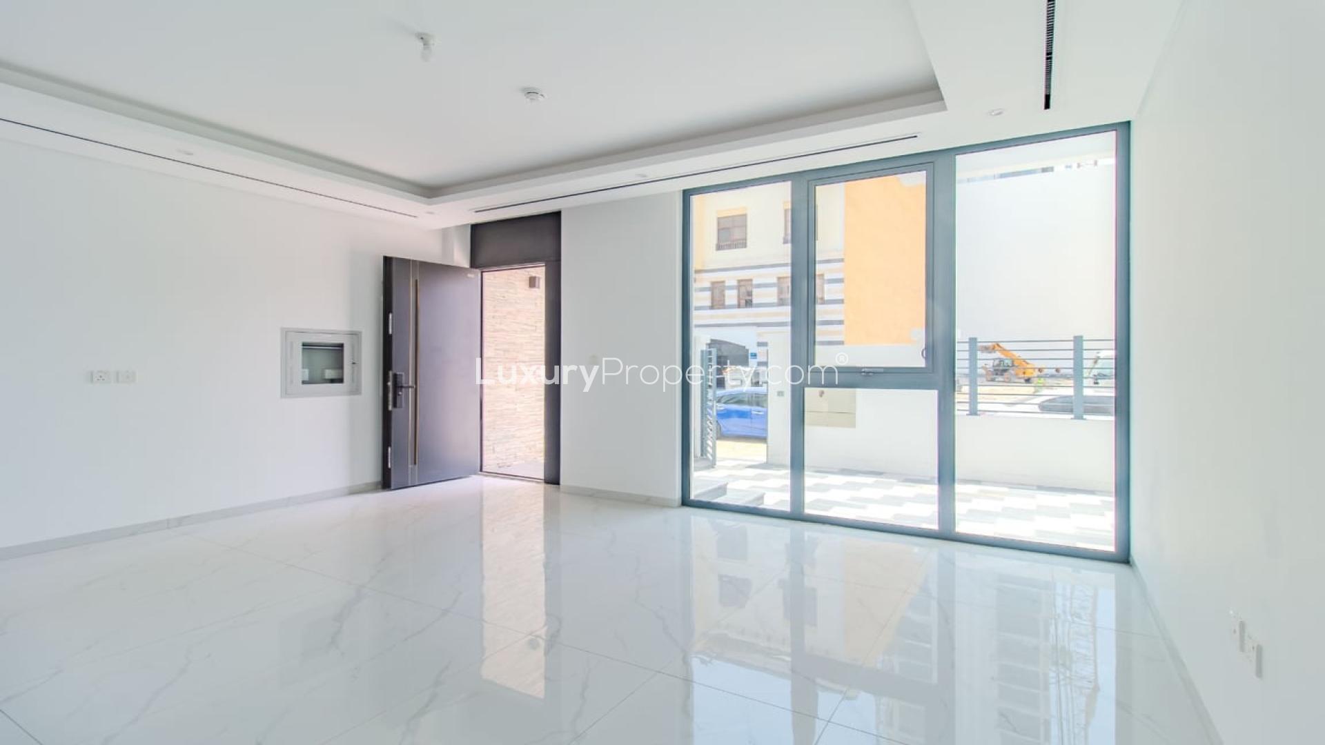 Modern living room in brand new Jumeirah Village Circle townhouse for sale