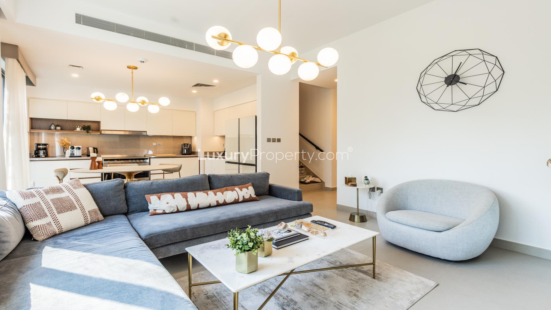 Modern living room with large windows in upgraded Camelia townhouse, Arabian Ranches 2