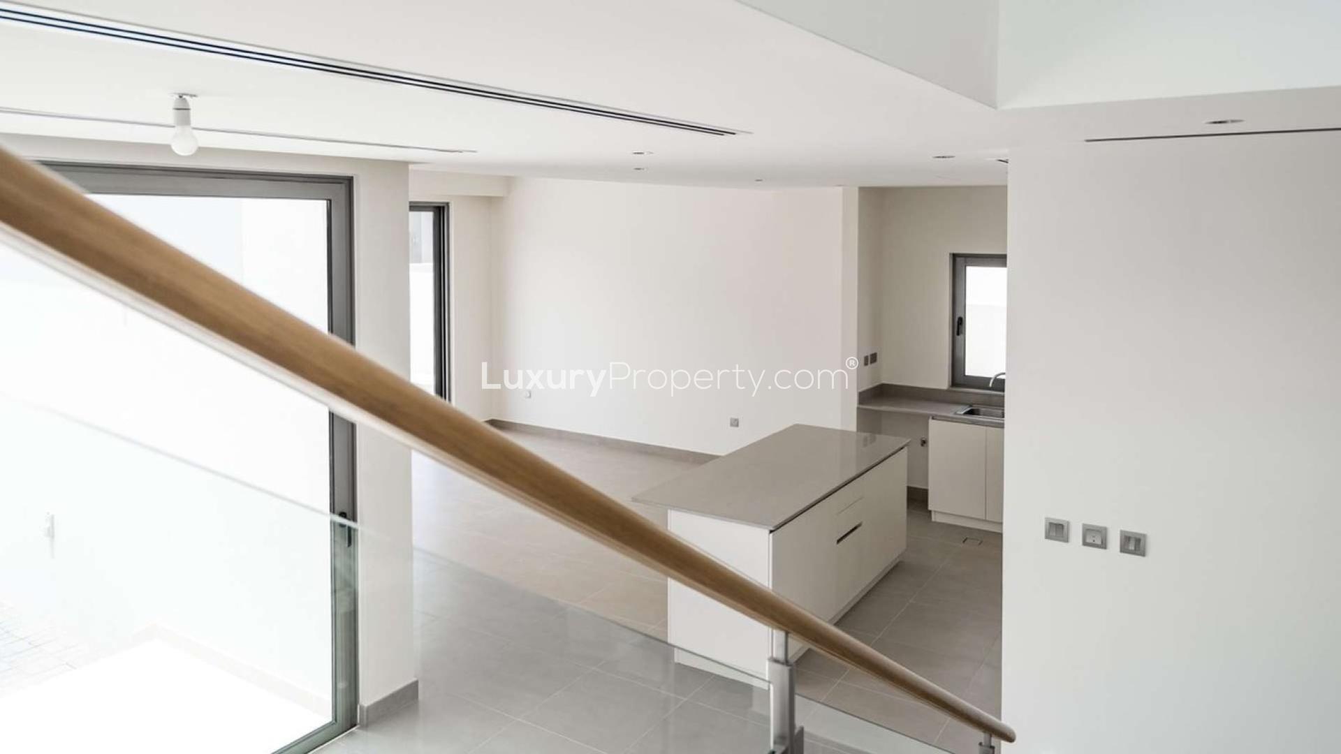 Modern kitchen and staircase in spacious 4-bedroom villa, Sidra, Dubai Hills Estate