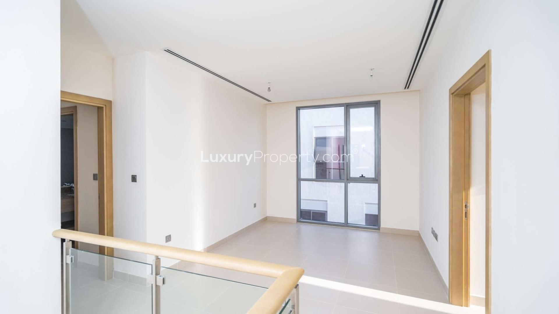 Modern kitchen in 4-bedroom villa, Sidra, Dubai Hills Estate, with island and sleek design