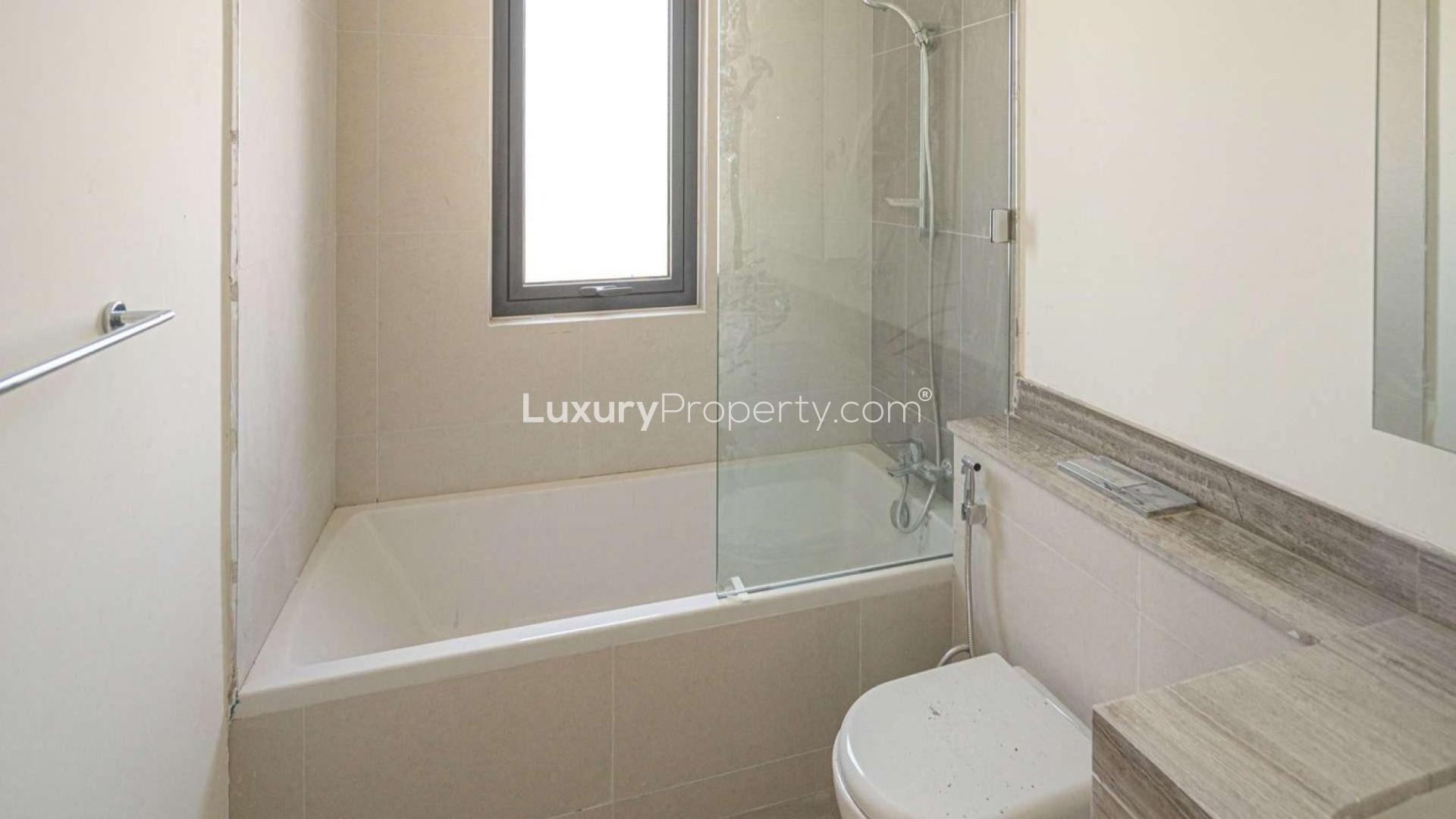 Modern kitchen and living area in four-bedroom villa, Maple at Dubai Hills Estate