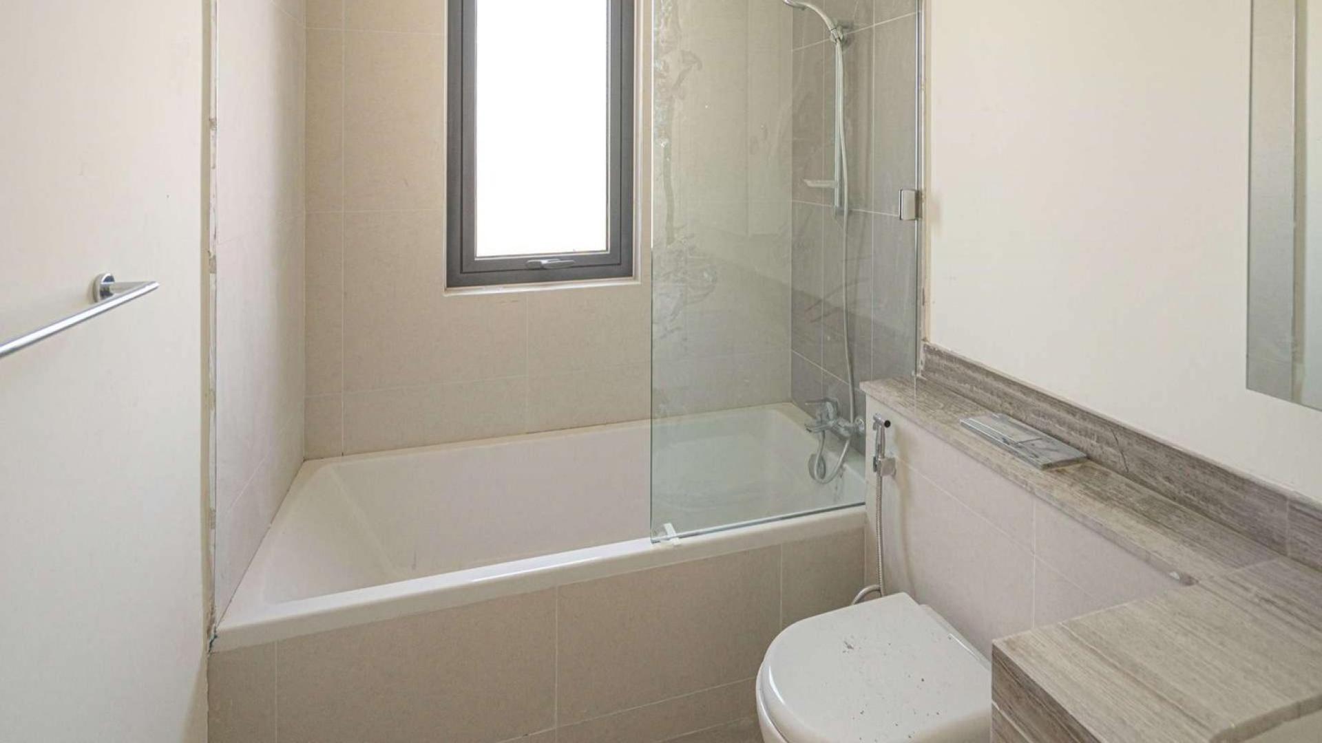 Modern kitchen and living area in four-bedroom villa, Maple at Dubai Hills Estate