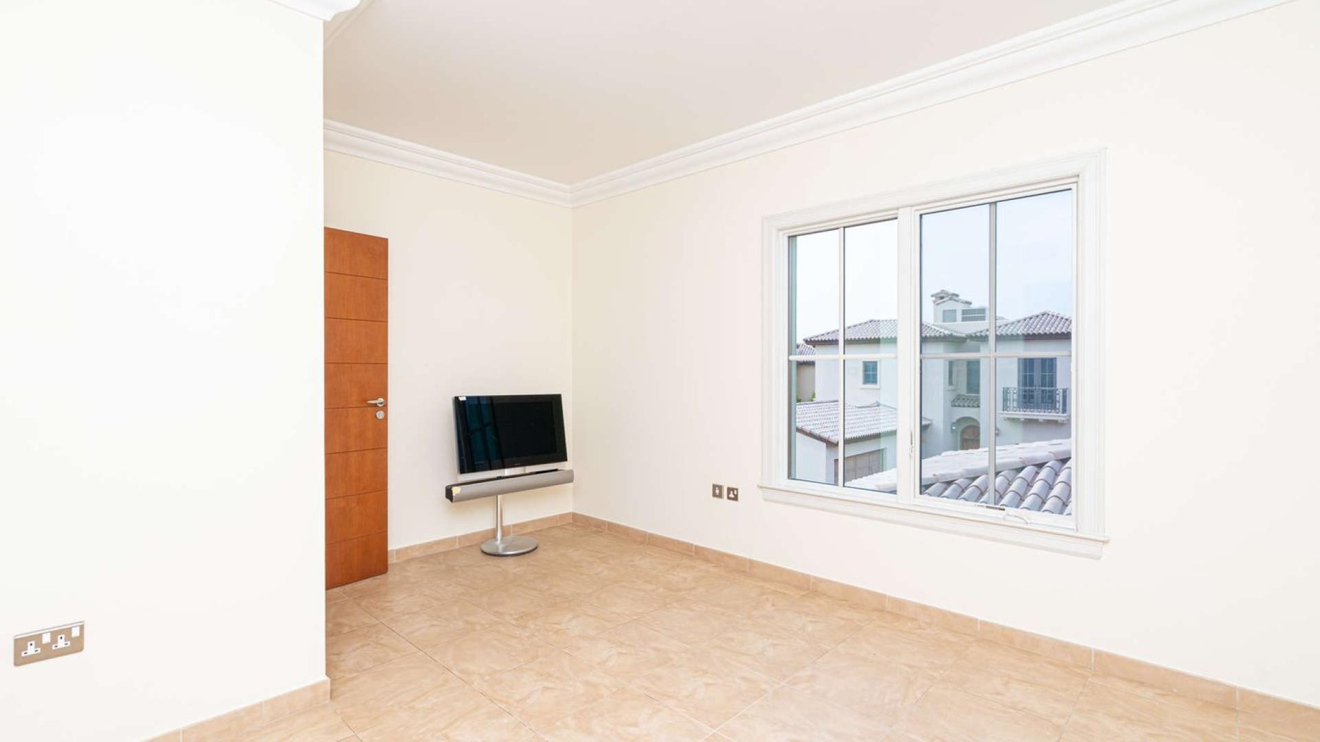 Bright interior of Whispering Pines Villa with large windows, Jumeirah Golf Estates