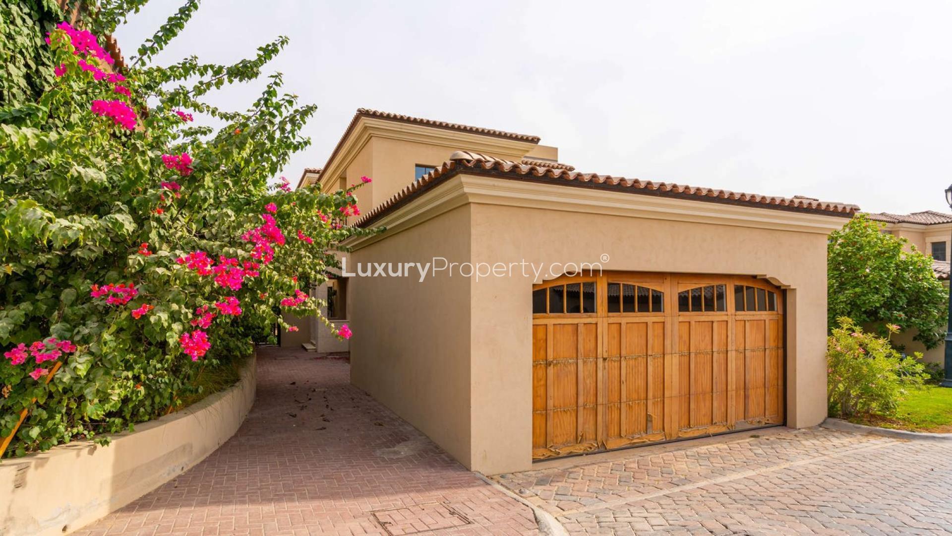 4-bedroom villa exterior, lush garden, Whispering Pines, Jumeirah Golf Estates, Dubai rental property