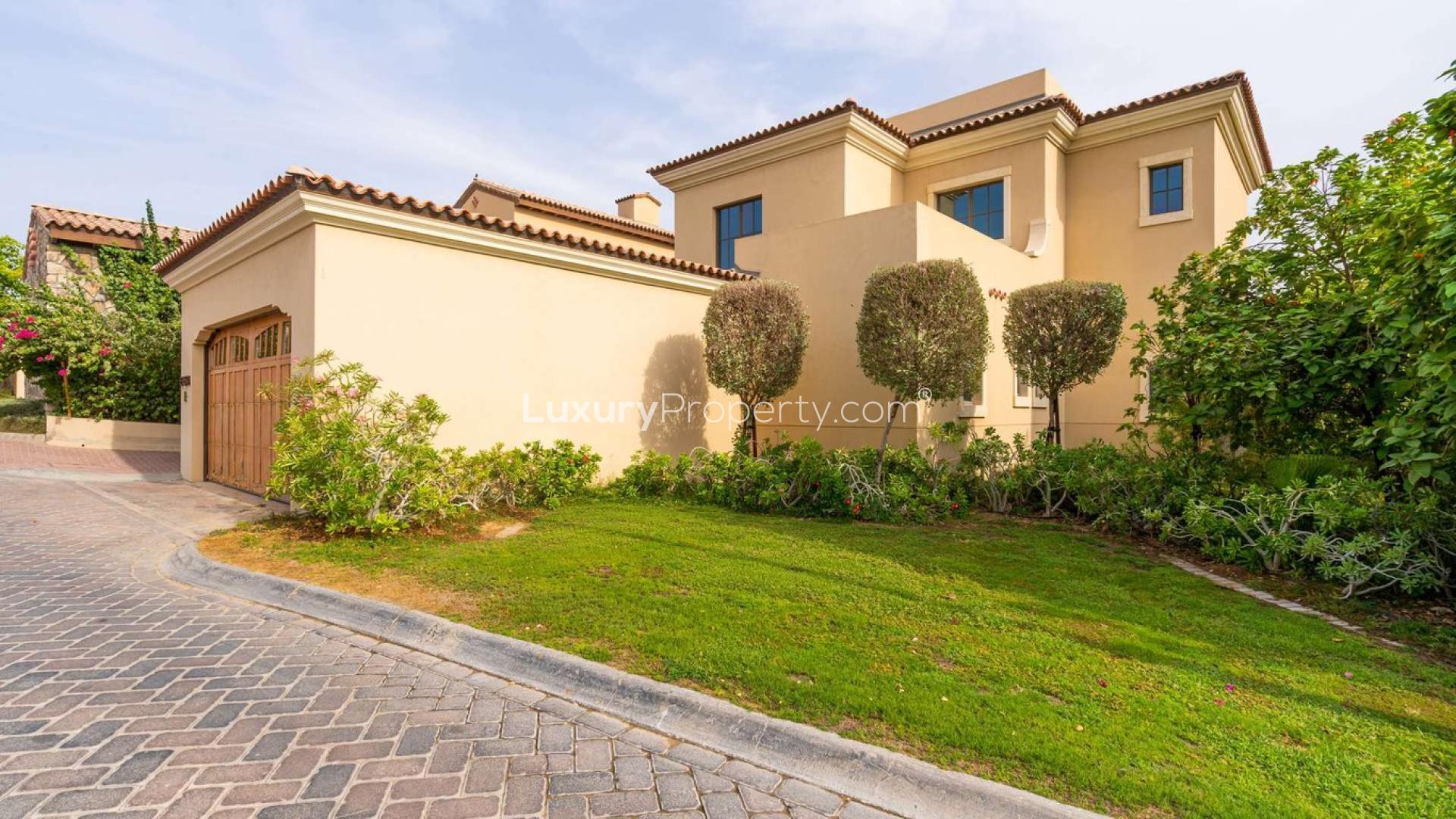4-bedroom villa exterior in Whispering Pines, Jumeirah Golf Estates, Dubai, lush green landscape